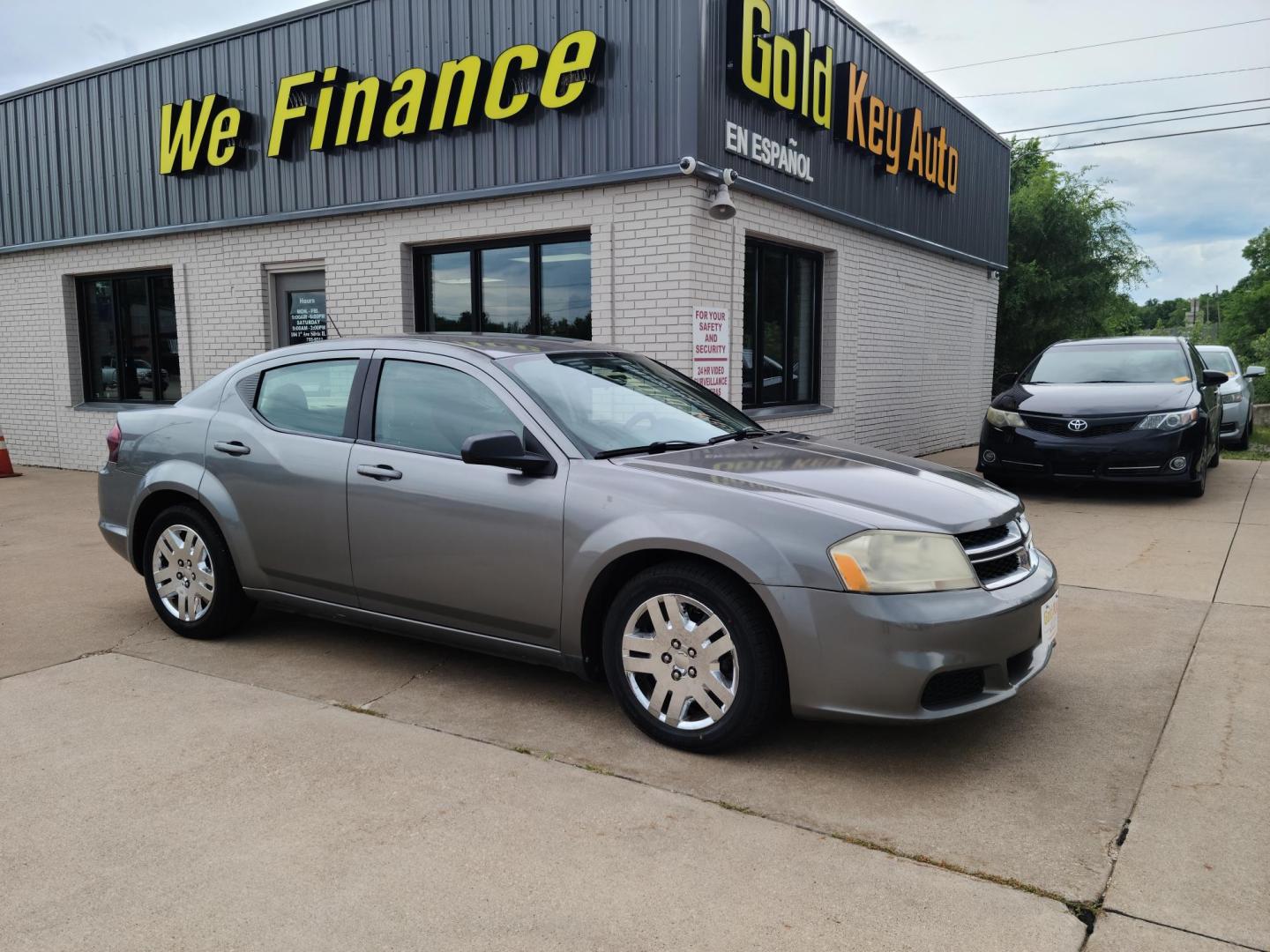 2013 Gray /tan Dodge Avenger SE (1C3CDZAG7DN) with an 3.6L V6 DOHC 24V FFV engine, 6-Speed Automatic transmission, located at 104 1st Avenue, Silvis, IL, 61282, (309) 755-9511, 41.515156, -90.425377 - Photo#0
