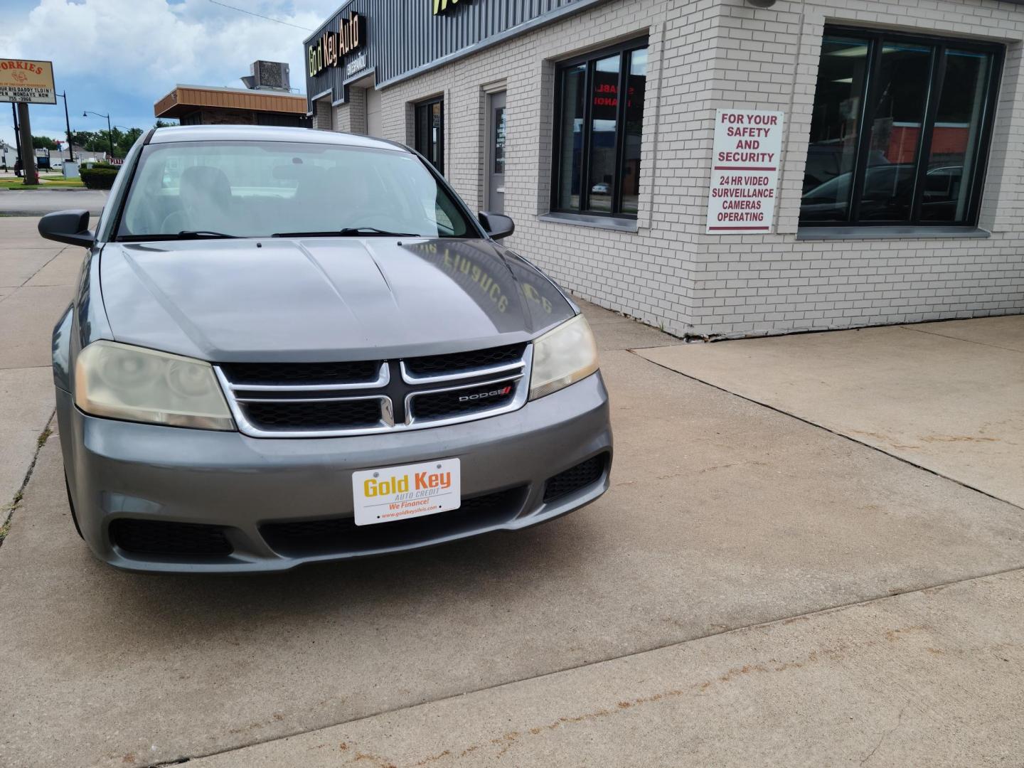 2013 Gray /tan Dodge Avenger SE (1C3CDZAG7DN) with an 3.6L V6 DOHC 24V FFV engine, 6-Speed Automatic transmission, located at 104 1st Avenue, Silvis, IL, 61282, (309) 755-9511, 41.515156, -90.425377 - Photo#1