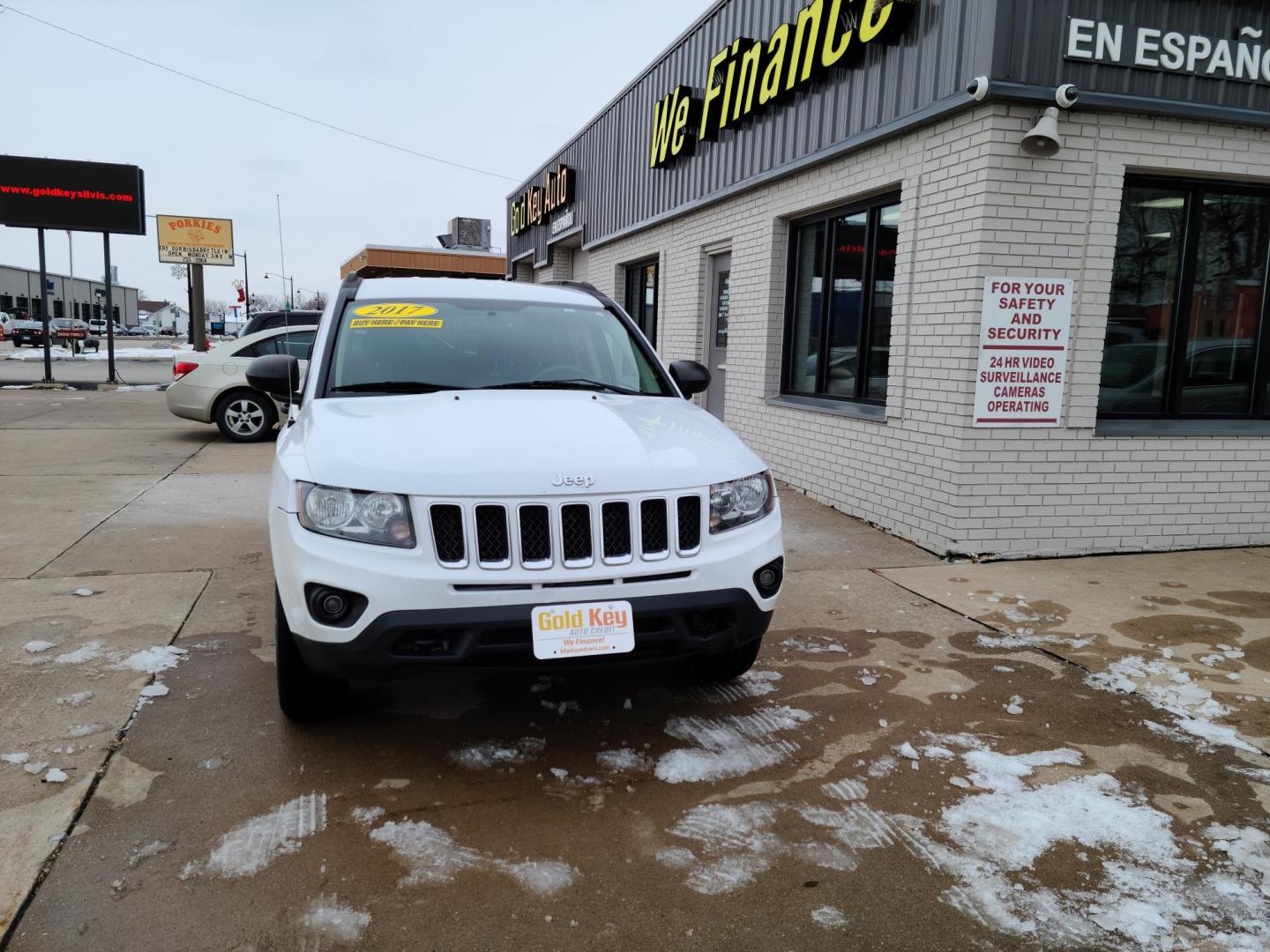 2017 Jeep Compass Sport 4WD (1C4NJDBBXHD) with an 2.4L L4 DOHC 16V engine, located at 104 1st Avenue, Silvis, IL, 61282, (309) 755-9511, 41.515156, -90.425377 - Photo#1