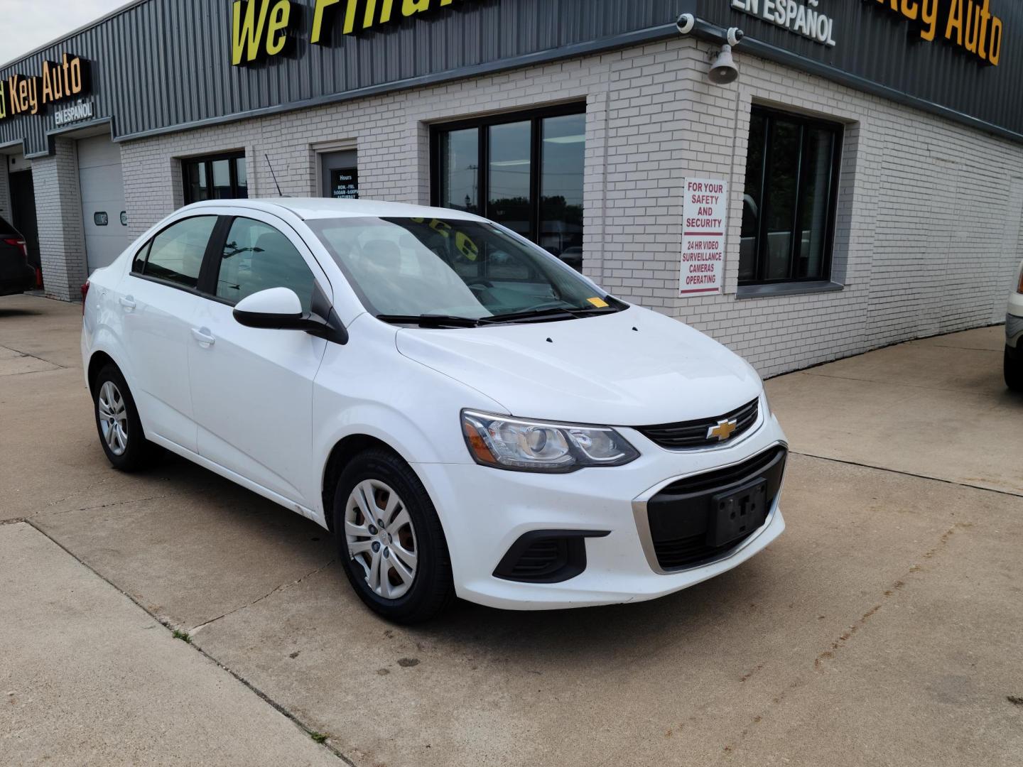 2017 Summit White /Jet Black/ Dark Titan Chevrolet Sonic LS Manual Sedan (1G1JB5SH6H4) with an 1.8L L4 DOHC 24V engine, 5M transmission, located at 104 1st Avenue, Silvis, IL, 61282, (309) 755-9511, 41.515156, -90.425377 - Photo#0