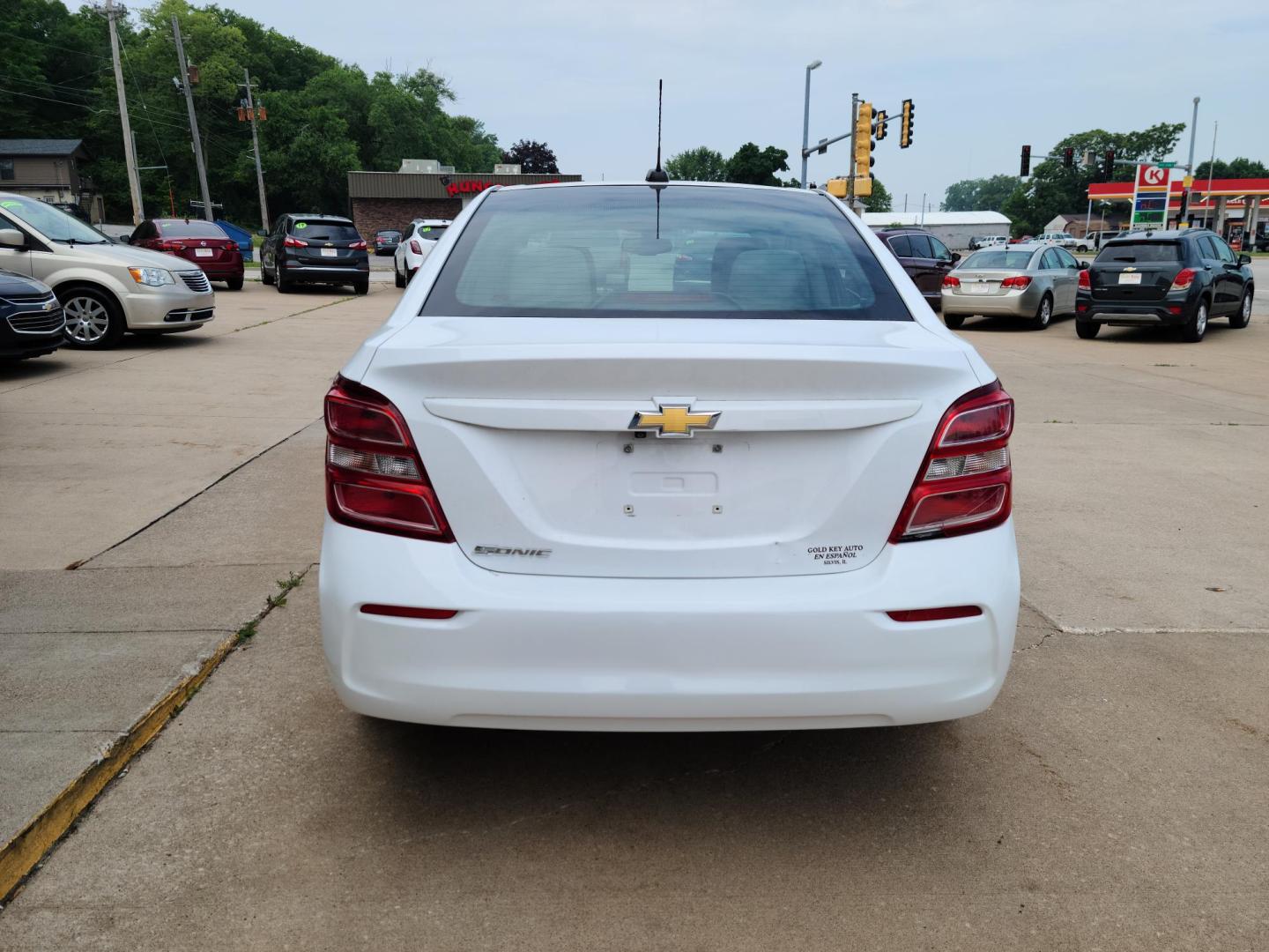 2017 Summit White /Jet Black/ Dark Titan Chevrolet Sonic LS Manual Sedan (1G1JB5SH6H4) with an 1.8L L4 DOHC 24V engine, 5M transmission, located at 104 1st Avenue, Silvis, IL, 61282, (309) 755-9511, 41.515156, -90.425377 - Photo#2