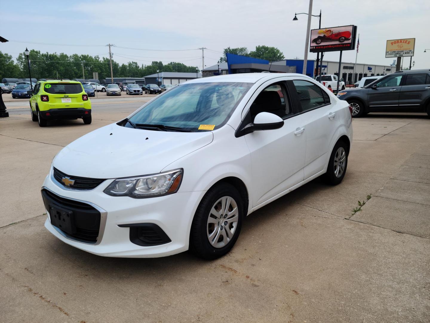 2017 Summit White /Jet Black/ Dark Titan Chevrolet Sonic LS Manual Sedan (1G1JB5SH6H4) with an 1.8L L4 DOHC 24V engine, 5M transmission, located at 104 1st Avenue, Silvis, IL, 61282, (309) 755-9511, 41.515156, -90.425377 - Photo#1