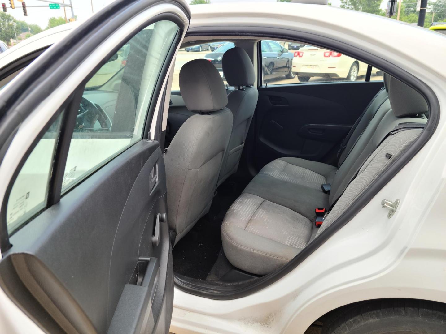 2017 Summit White /Jet Black/ Dark Titan Chevrolet Sonic LS Manual Sedan (1G1JB5SH6H4) with an 1.8L L4 DOHC 24V engine, 5M transmission, located at 104 1st Avenue, Silvis, IL, 61282, (309) 755-9511, 41.515156, -90.425377 - Photo#4