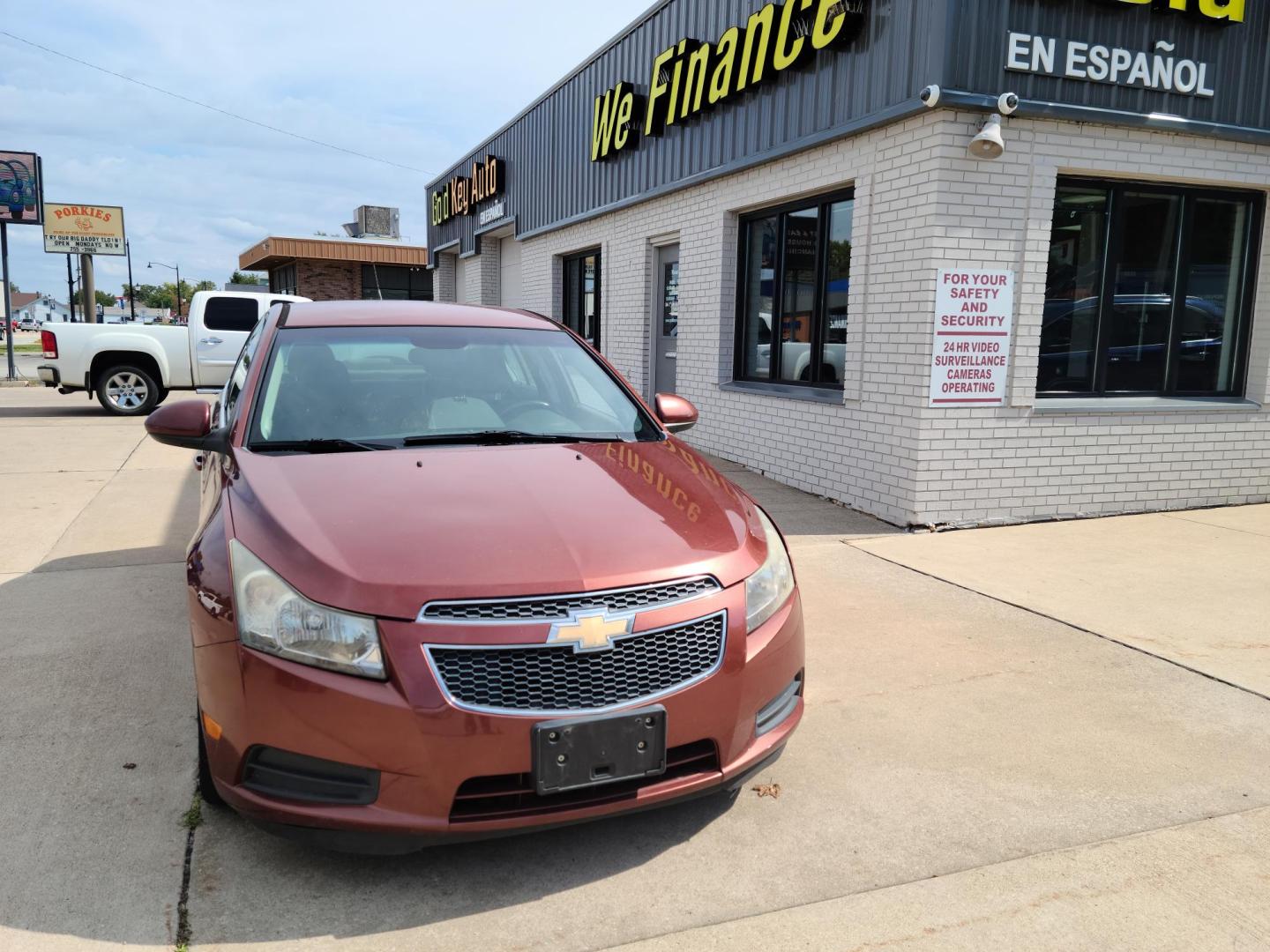 2012 Ruby Red Metallic Tinted Clearcoat /Black Chevrolet Cruze 1LT (1G1PF5SC4C7) with an 1.4L L4 DOHC 16V TURBO engine, 6-Speed Automatic transmission, located at 104 1st Avenue, Silvis, IL, 61282, (309) 755-9511, 41.515156, -90.425377 - Photo#1
