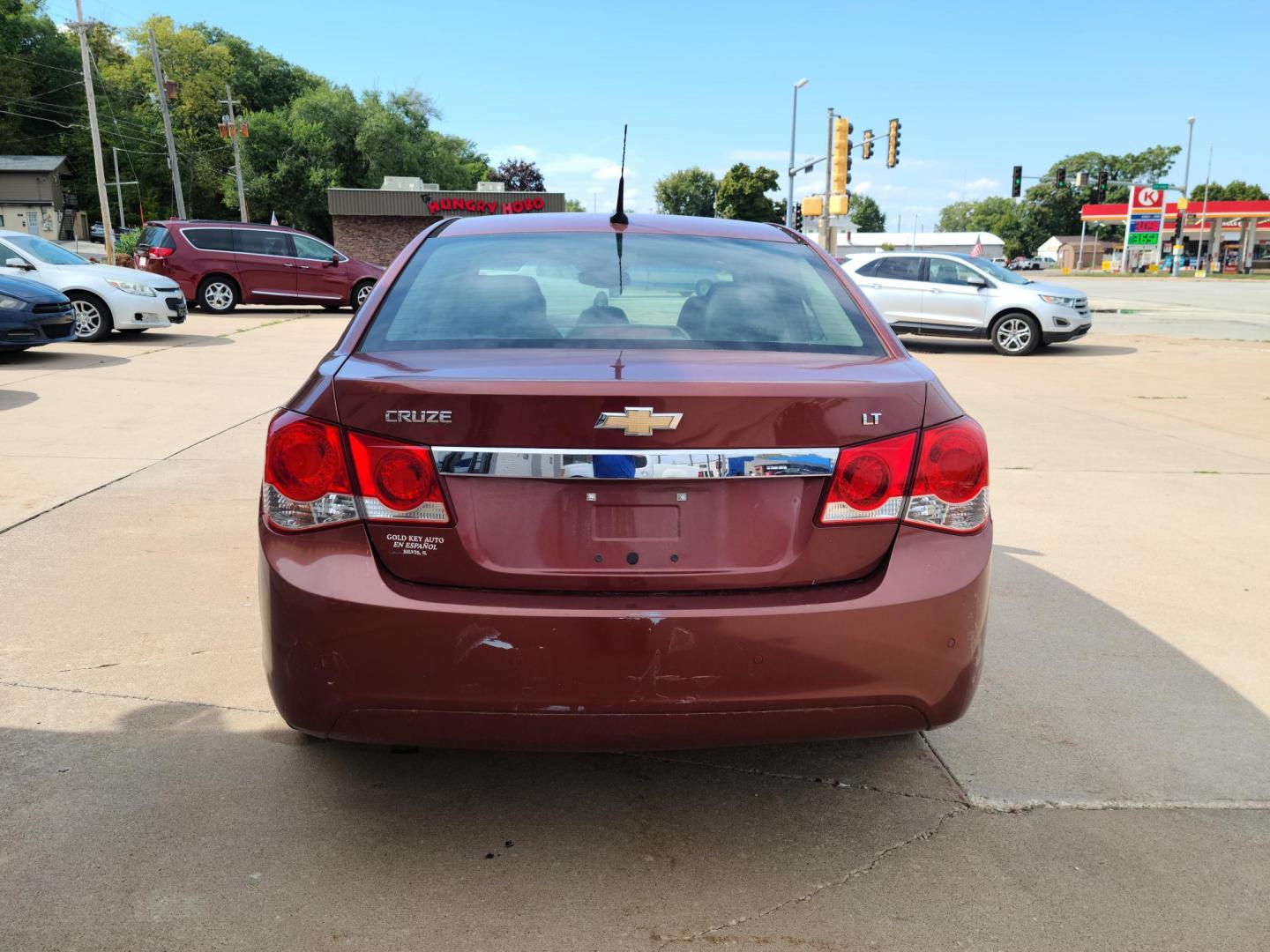 2012 Ruby Red Metallic Tinted Clearcoat /Black Chevrolet Cruze 1LT (1G1PF5SC4C7) with an 1.4L L4 DOHC 16V TURBO engine, 6-Speed Automatic transmission, located at 104 1st Avenue, Silvis, IL, 61282, (309) 755-9511, 41.515156, -90.425377 - Photo#3