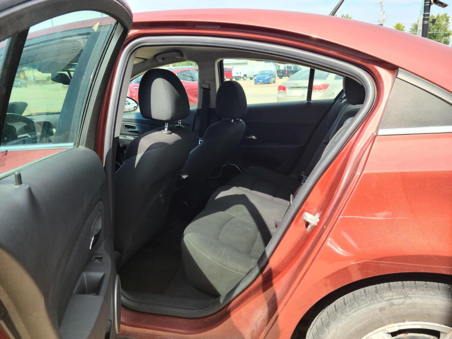 2012 Ruby Red Metallic Tinted Clearcoat /Black Chevrolet Cruze 1LT (1G1PF5SC4C7) with an 1.4L L4 DOHC 16V TURBO engine, 6-Speed Automatic transmission, located at 104 1st Avenue, Silvis, IL, 61282, (309) 755-9511, 41.515156, -90.425377 - Photo#4
