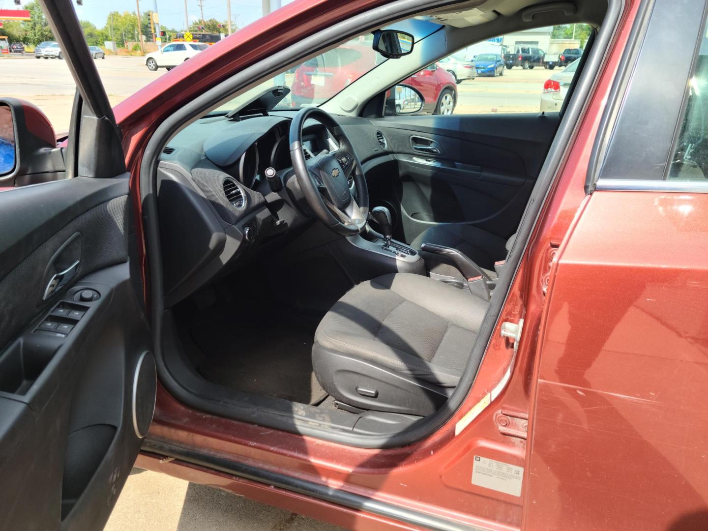2012 Ruby Red Metallic Tinted Clearcoat /Black Chevrolet Cruze 1LT (1G1PF5SC4C7) with an 1.4L L4 DOHC 16V TURBO engine, 6-Speed Automatic transmission, located at 104 1st Avenue, Silvis, IL, 61282, (309) 755-9511, 41.515156, -90.425377 - Photo#5