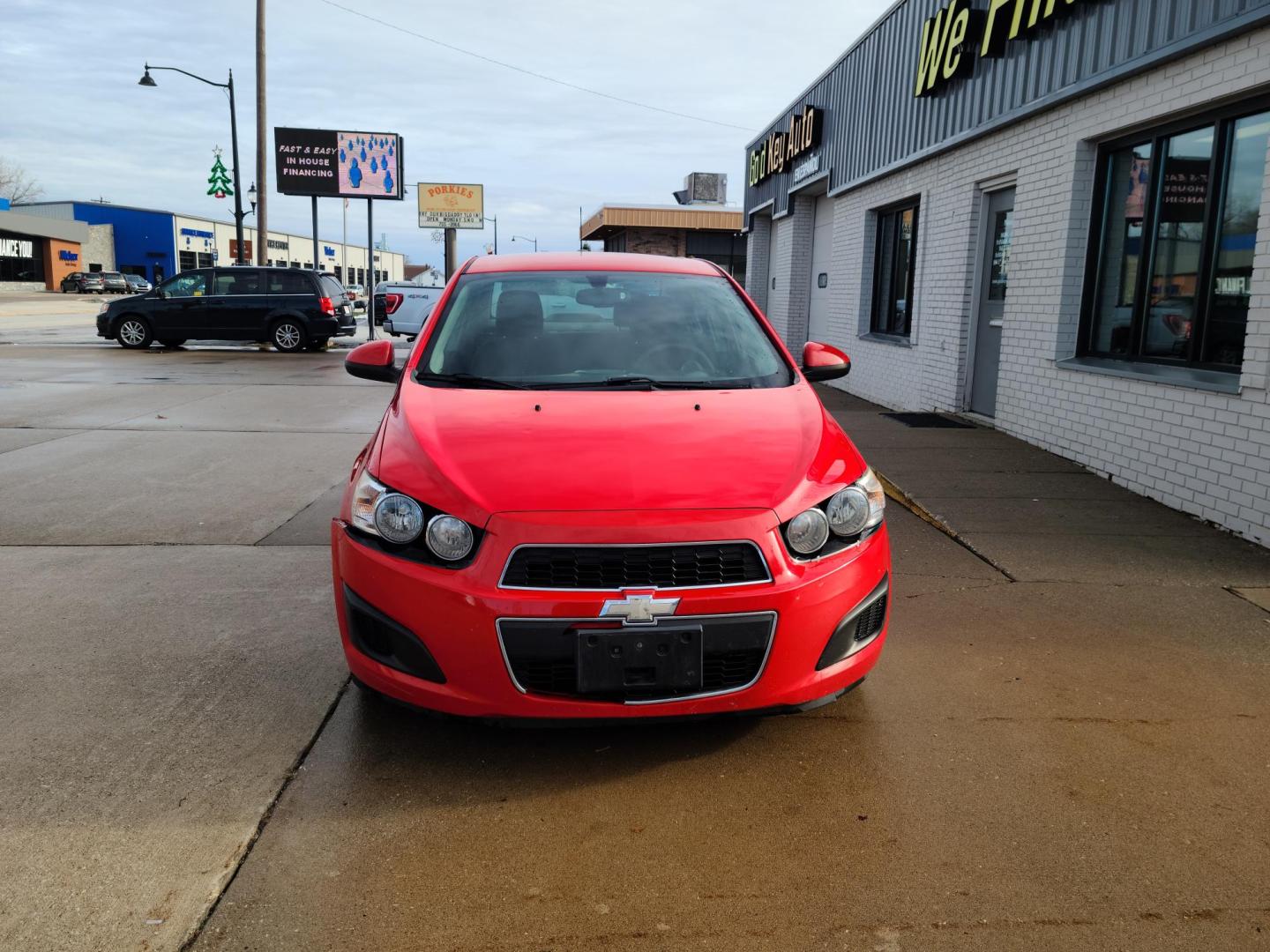 2015 Red Hot /Jet Black/ Brick Chevrolet Sonic LT Auto Sedan (1G1JC5SG3F4) with an 1.8L L4 DOHC 24V engine, 6-Speed Automatic transmission, located at 104 1st Avenue, Silvis, IL, 61282, (309) 755-9511, 41.515156, -90.425377 - Photo#1