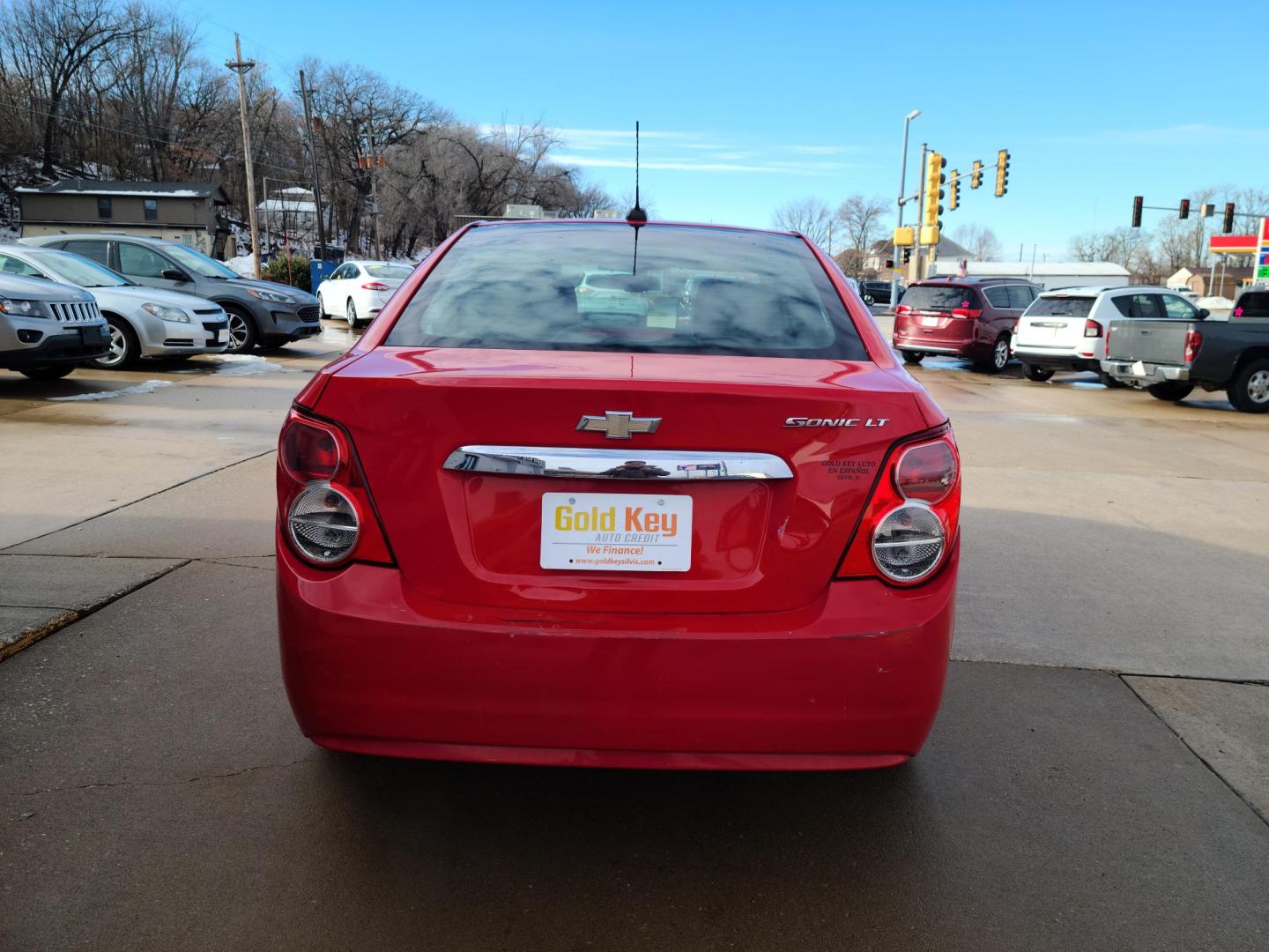 2015 Red Hot /Jet Black/ Brick Chevrolet Sonic LT Auto Sedan (1G1JC5SG3F4) with an 1.8L L4 DOHC 24V engine, 6-Speed Automatic transmission, located at 104 1st Avenue, Silvis, IL, 61282, (309) 755-9511, 41.515156, -90.425377 - Photo#3