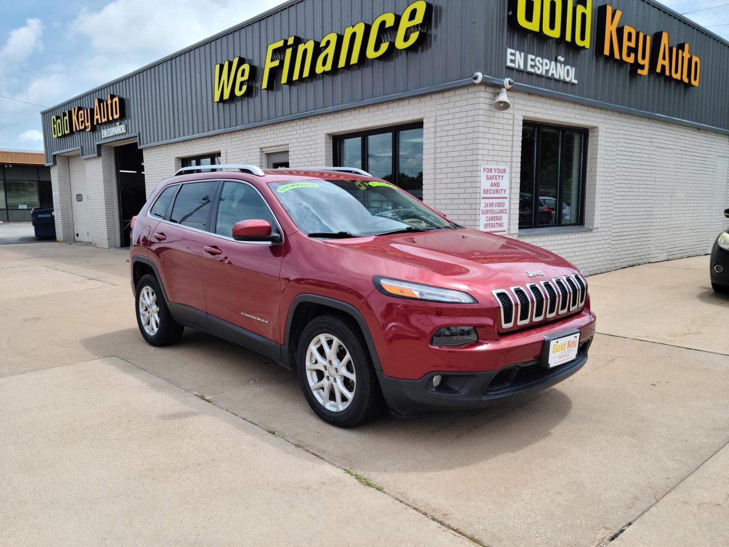 2015 DP Cherry Red Crystal PC /Black Jeep Cherokee Latitude FWD (1C4PJLCS1FW) with an 3.2L V6 DOHC 24V engine, 9-Speed Automatic transmission, located at 104 1st Avenue, Silvis, IL, 61282, (309) 755-9511, 41.515156, -90.425377 - Photo#0