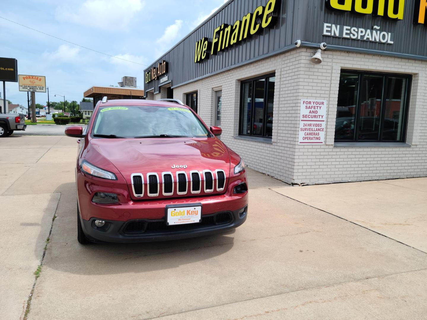 2015 DP Cherry Red Crystal PC /Black Jeep Cherokee Latitude FWD (1C4PJLCS1FW) with an 3.2L V6 DOHC 24V engine, 9-Speed Automatic transmission, located at 104 1st Avenue, Silvis, IL, 61282, (309) 755-9511, 41.515156, -90.425377 - Photo#1