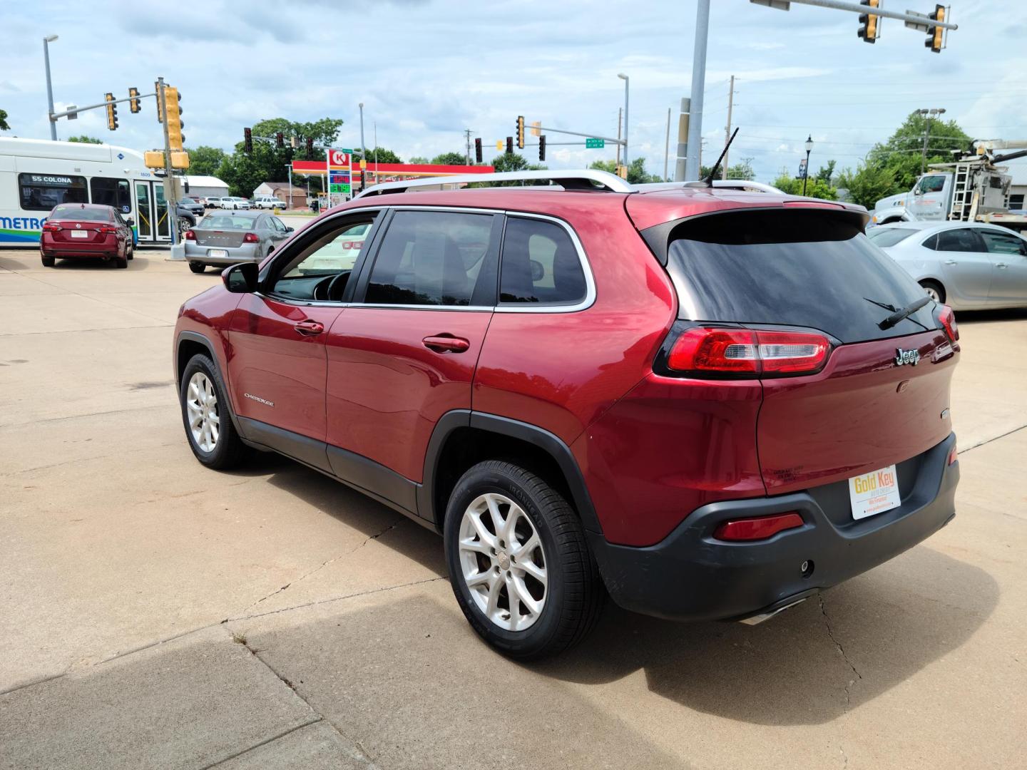 2015 DP Cherry Red Crystal PC /Black Jeep Cherokee Latitude FWD (1C4PJLCS1FW) with an 3.2L V6 DOHC 24V engine, 9-Speed Automatic transmission, located at 104 1st Avenue, Silvis, IL, 61282, (309) 755-9511, 41.515156, -90.425377 - Photo#2