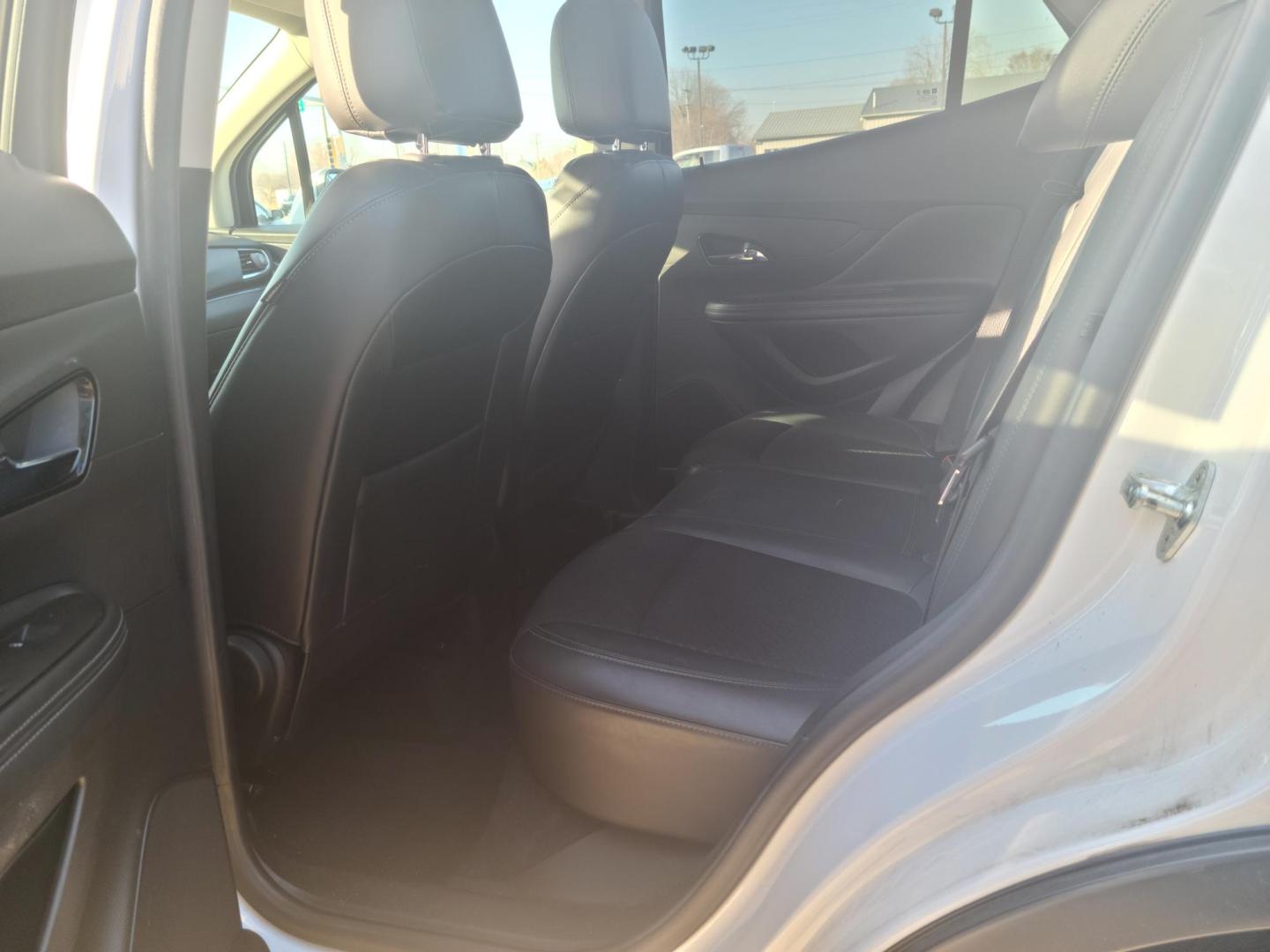 2017 /Black Buick Encore Preferred AWD (KL4CJESB9HB) with an 1.4L L4 DOHC 16V TURBO engine, 6A transmission, located at 104 1st Avenue, Silvis, IL, 61282, (309) 755-9511, 41.515156, -90.425377 - Photo#4