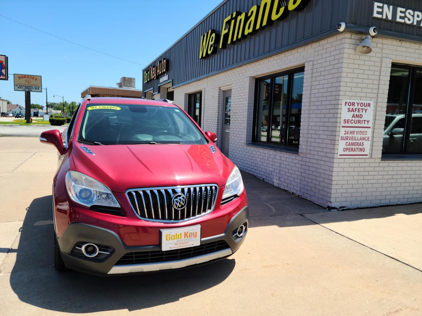 2015 Ruby Red Metallic Tinted Clearcoat /Black Buick Encore Convenience FWD (KL4CJBSB1FB) with an 1.4L L4 DOHC 16V TURBO engine, 6-Speed Automatic transmission, located at 104 1st Avenue, Silvis, IL, 61282, (309) 755-9511, 41.515156, -90.425377 - Photo#1