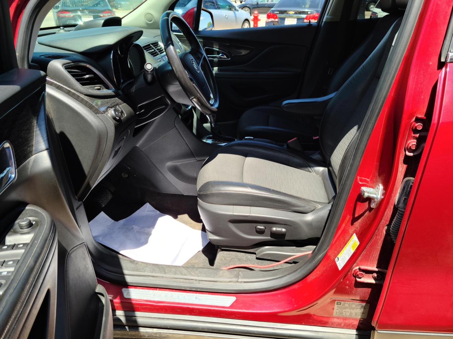 2015 Ruby Red Metallic Tinted Clearcoat /Black Buick Encore Convenience FWD (KL4CJBSB1FB) with an 1.4L L4 DOHC 16V TURBO engine, 6-Speed Automatic transmission, located at 104 1st Avenue, Silvis, IL, 61282, (309) 755-9511, 41.515156, -90.425377 - Photo#5