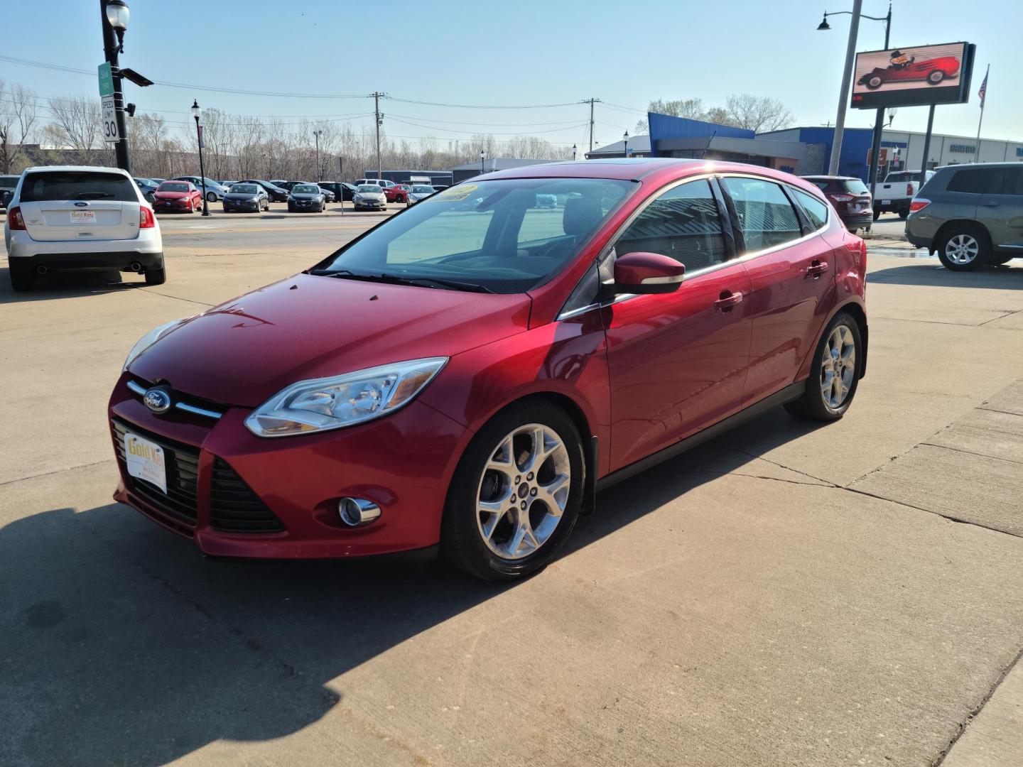 2012 Ruby Red Metallic Tinted Clearcoat /Black Ford Focus SEL (1FAHP3M24CL) with an 2.0L L4 DOHC 16V engine, 6-Speed Automatic transmission, located at 104 1st Avenue, Silvis, IL, 61282, (309) 755-9511, 41.515156, -90.425377 - Photo#0