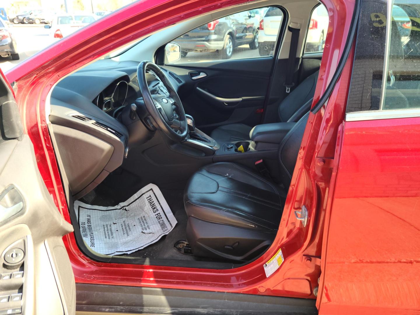 2012 Ruby Red Metallic Tinted Clearcoat /Black Ford Focus SEL (1FAHP3M24CL) with an 2.0L L4 DOHC 16V engine, 6-Speed Automatic transmission, located at 104 1st Avenue, Silvis, IL, 61282, (309) 755-9511, 41.515156, -90.425377 - Photo#5
