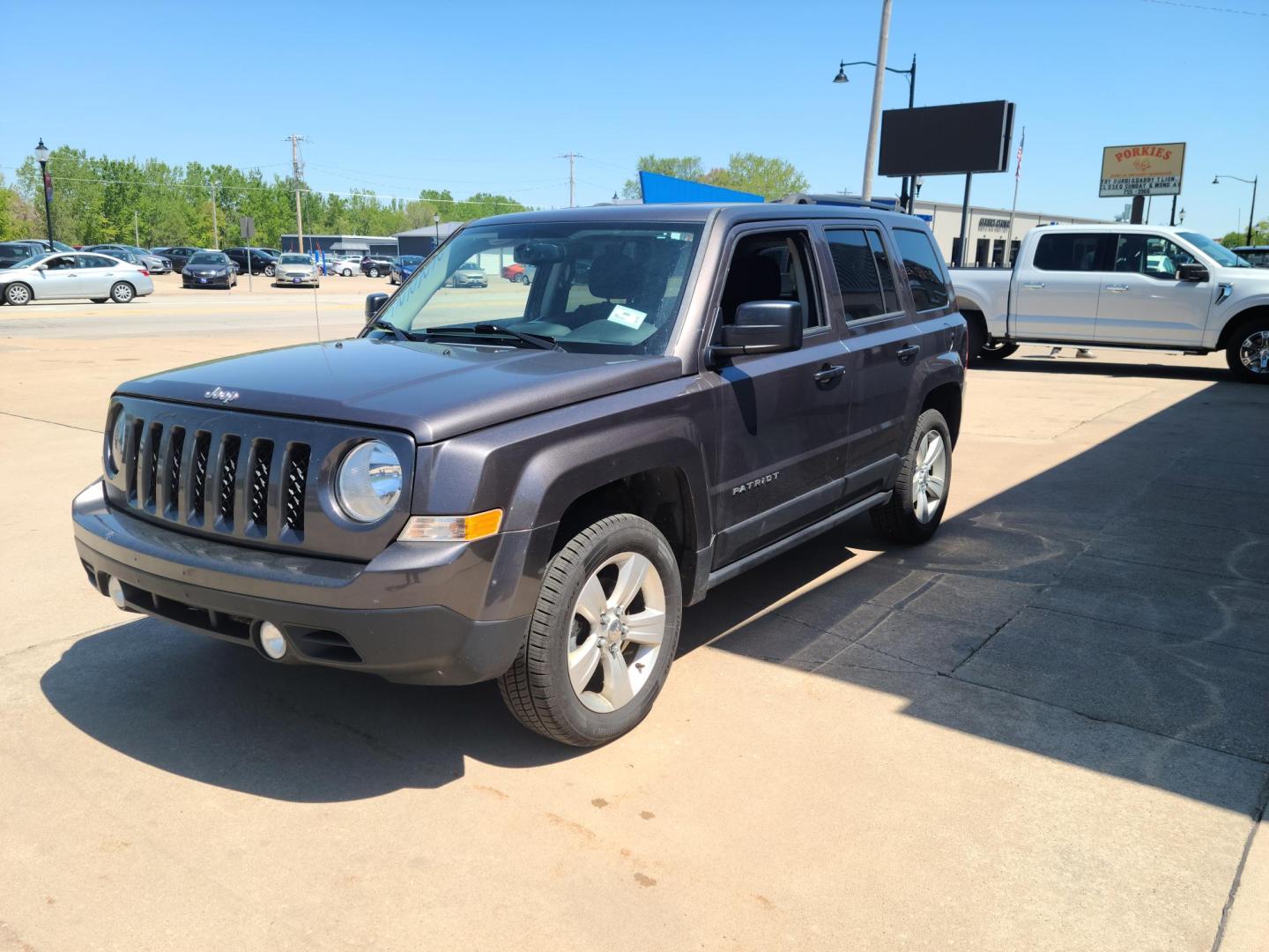 2015 Gray Jeep Patriot Latitude 4WD (1C4NJRFB2FD) with an 2.4L L4 DOHC 16V engine, Auto transmission, located at 104 1st Avenue, Silvis, IL, 61282, (309) 755-9511, 41.515156, -90.425377 - Photo#1