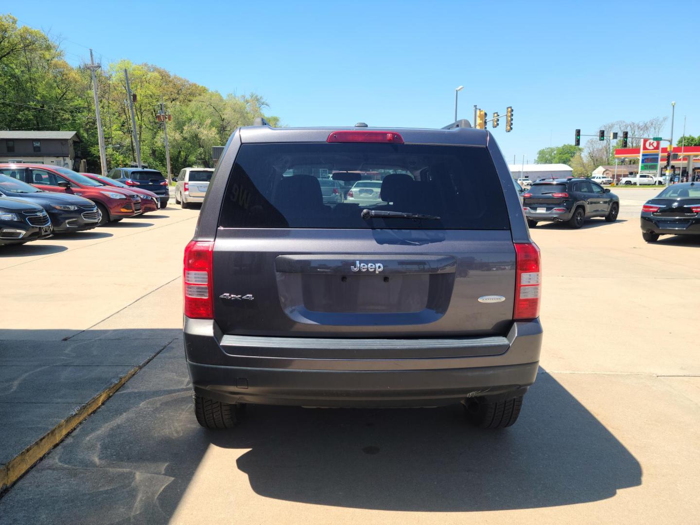 2015 Gray Jeep Patriot Latitude 4WD (1C4NJRFB2FD) with an 2.4L L4 DOHC 16V engine, Auto transmission, located at 104 1st Avenue, Silvis, IL, 61282, (309) 755-9511, 41.515156, -90.425377 - Photo#2