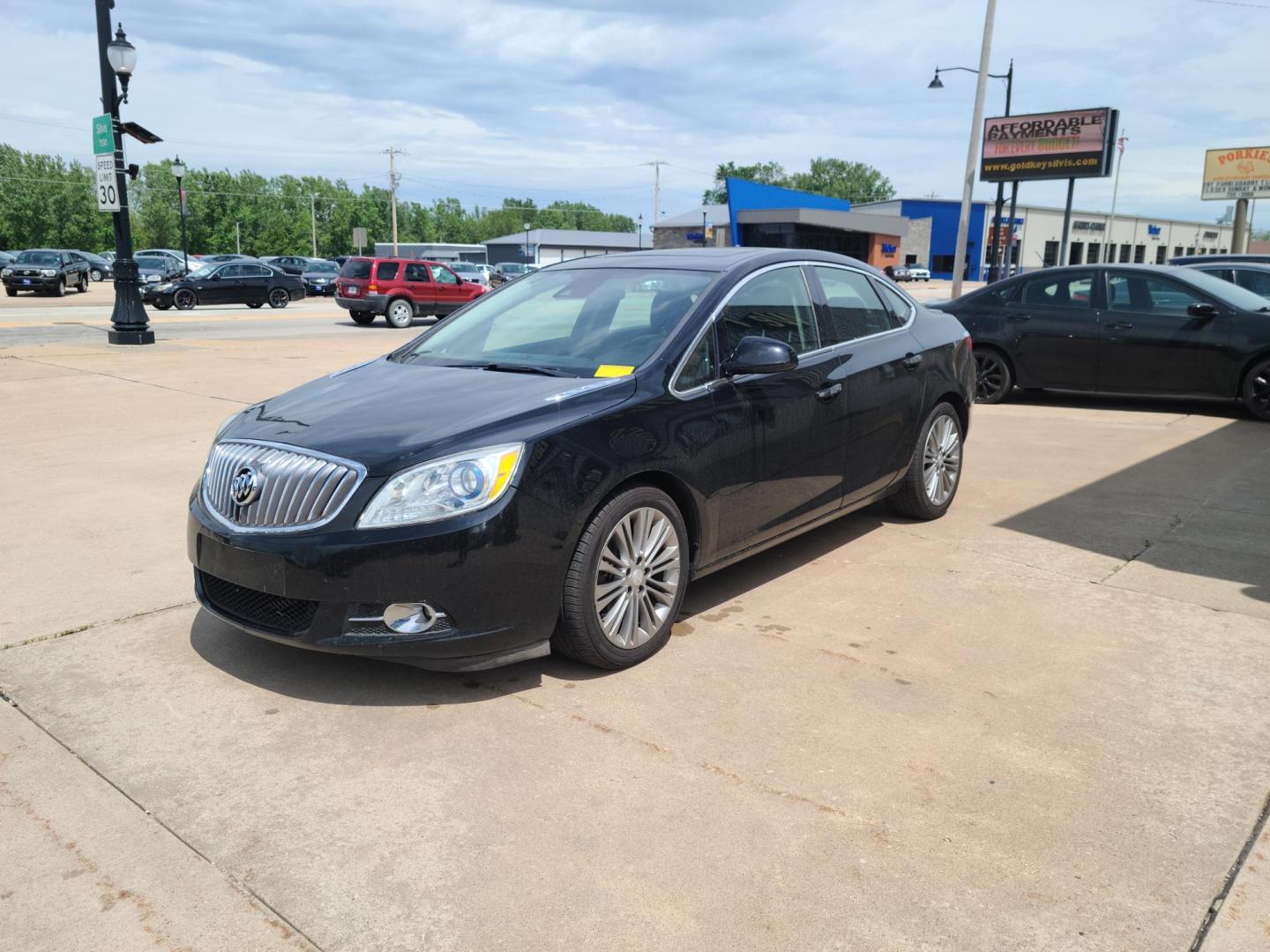2016 Carbon Black Metallic Buick Verano Leather (1G4PS5SK4G4) with an 2.4L L4 DOHC 16V FFV engine, 6A transmission, located at 104 1st Avenue, Silvis, IL, 61282, (309) 755-9511, 41.515156, -90.425377 - Photo#1