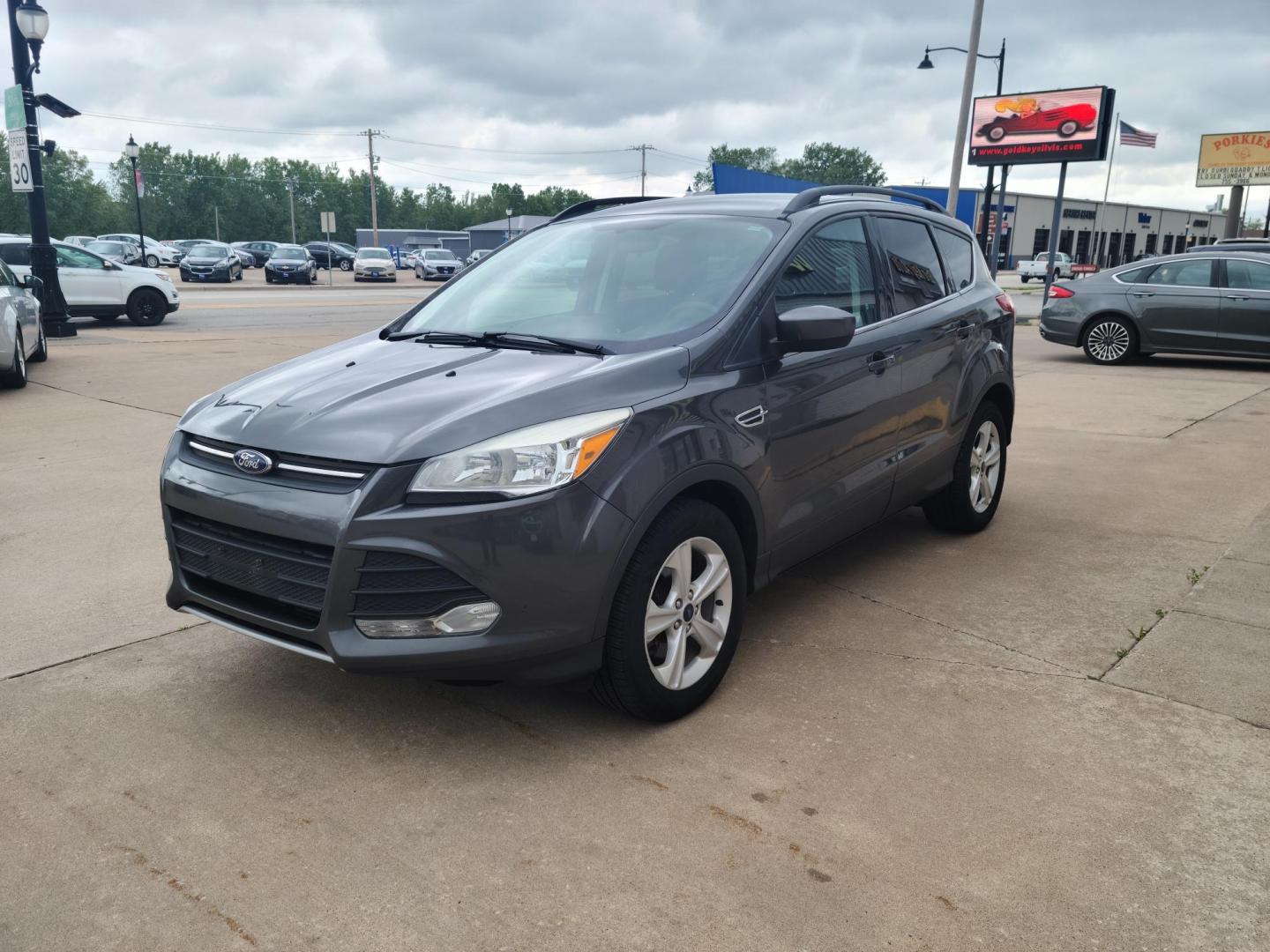 2015 Gray /Black Ford Escape SE FWD (1FMCU0G90FU) with an 2.0L L4 DOHC 16V engine, 6-Speed Automatic transmission, located at 104 1st Avenue, Silvis, IL, 61282, (309) 755-9511, 41.515156, -90.425377 - Photo#1