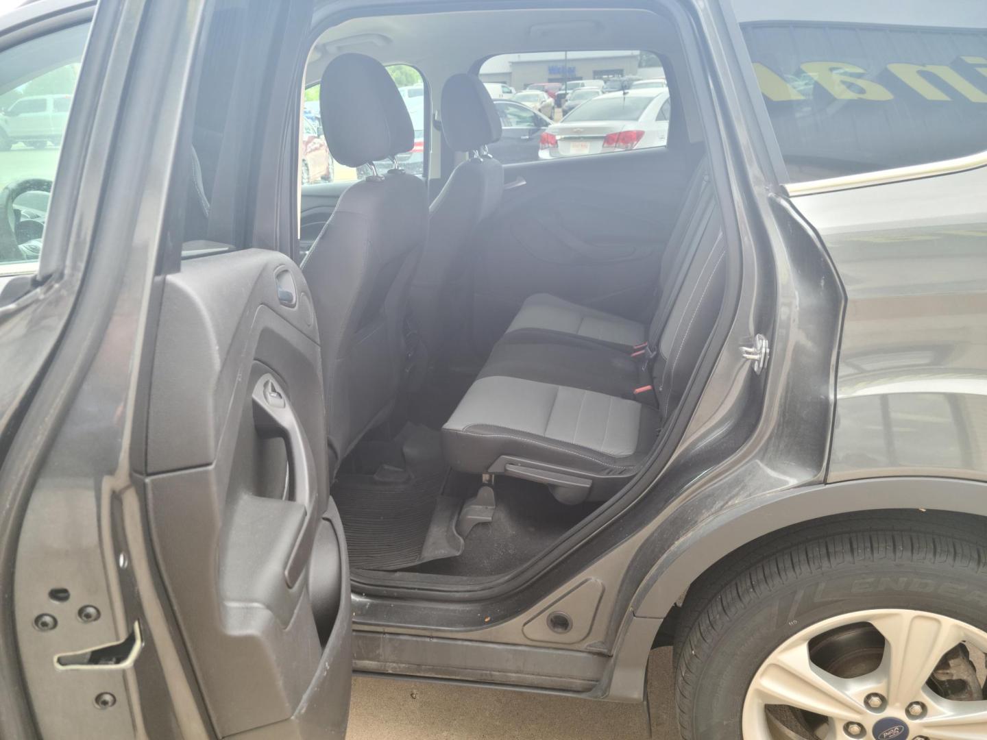 2015 Gray /Black Ford Escape SE FWD (1FMCU0G90FU) with an 2.0L L4 DOHC 16V engine, 6-Speed Automatic transmission, located at 104 1st Avenue, Silvis, IL, 61282, (309) 755-9511, 41.515156, -90.425377 - Photo#4