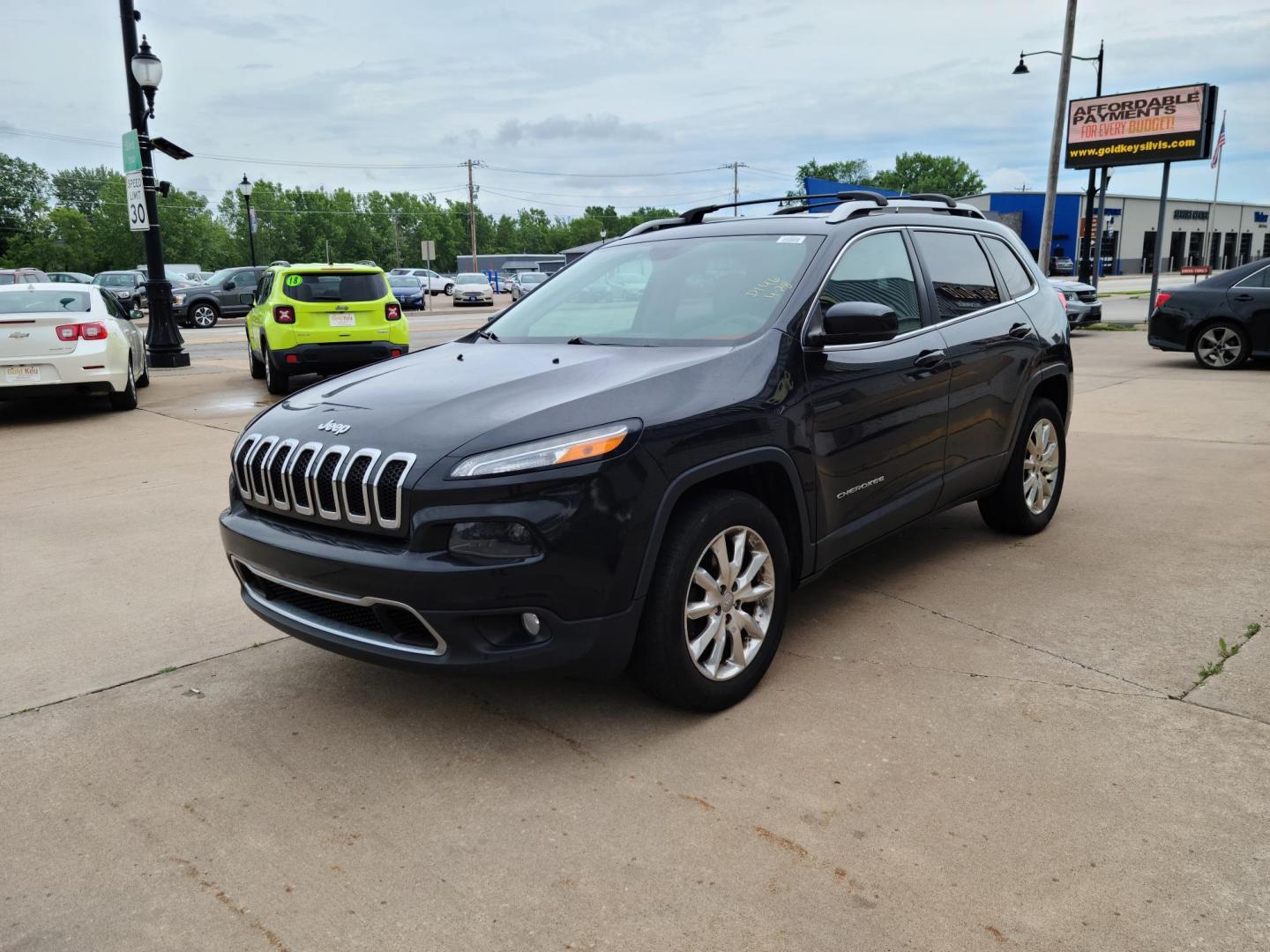 2015 Carbon Black Metallic /Black Jeep Cherokee Limited 4WD (1C4PJMDS7FW) with an 3.2L V6 DOHC 24V engine, 9-Speed Automatic transmission, located at 104 1st Avenue, Silvis, IL, 61282, (309) 755-9511, 41.515156, -90.425377 - Photo#1