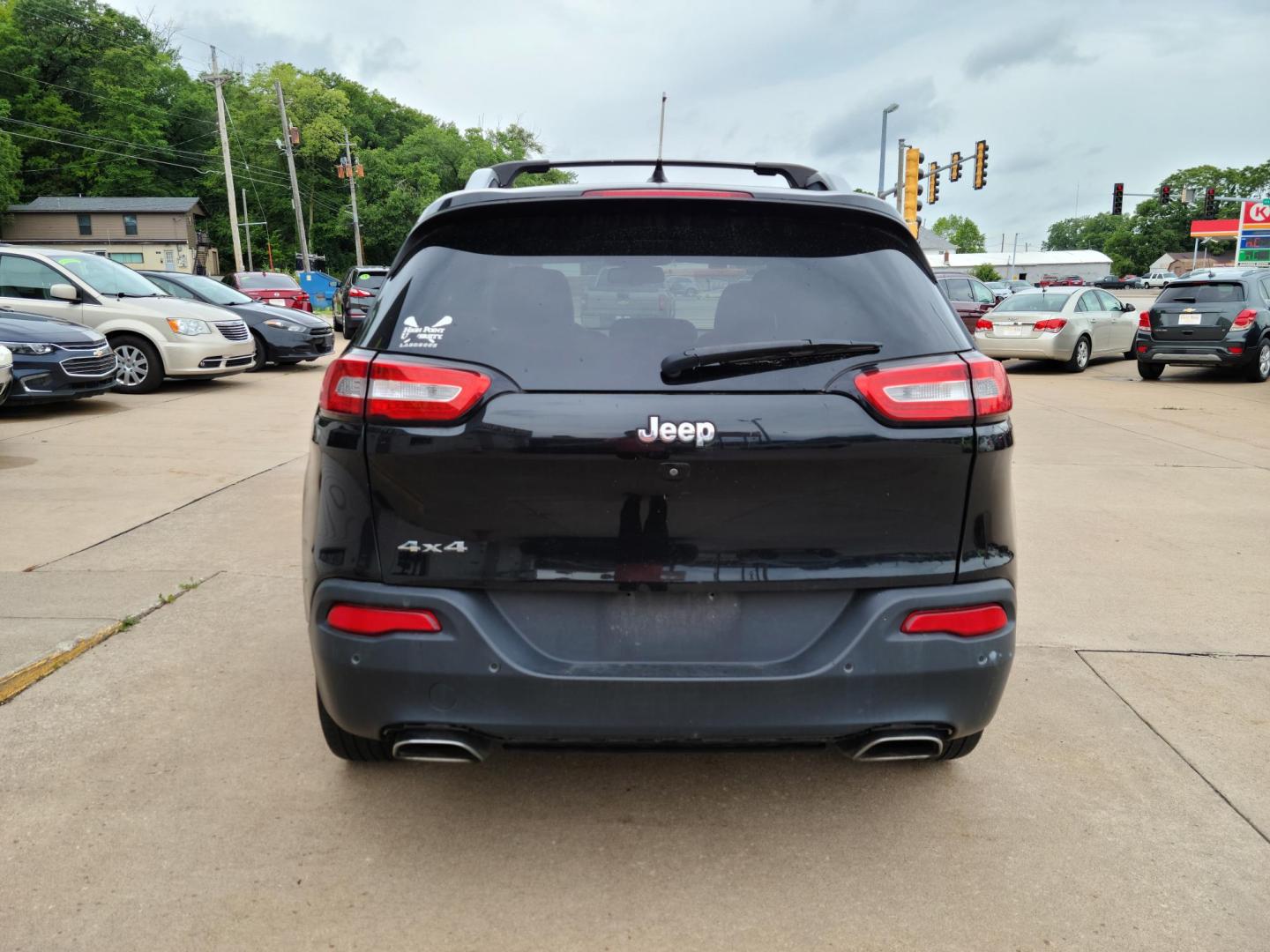 2015 Carbon Black Metallic /Black Jeep Cherokee Limited 4WD (1C4PJMDS7FW) with an 3.2L V6 DOHC 24V engine, 9-Speed Automatic transmission, located at 104 1st Avenue, Silvis, IL, 61282, (309) 755-9511, 41.515156, -90.425377 - Photo#2