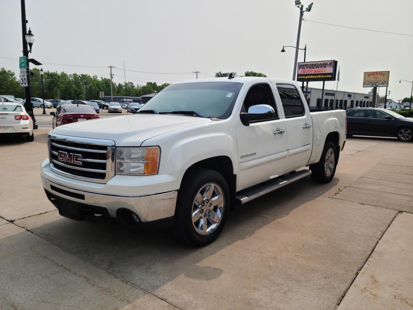 2012 GMC Sierra 1500 SLT Crew Cab 4WD (3GTP2WE70CG) with an 5.3L V8 OHV 16V FFV engine, 6-Speed Automatic transmission, located at 104 1st Avenue, Silvis, IL, 61282, (309) 755-9511, 41.515156, -90.425377 - Photo#1