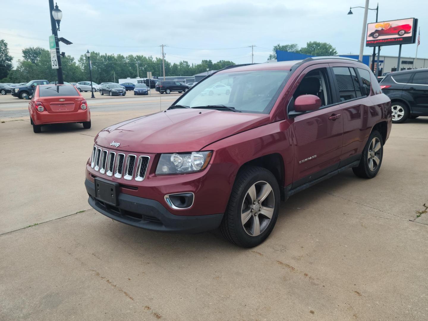 2017 Jeep Compass Latitude FWD (1C4NJCEB2HD) with an 2.4L L4 DOHC 16V engine, CVT transmission, located at 104 1st Avenue, Silvis, IL, 61282, (309) 755-9511, 41.515156, -90.425377 - Photo#1