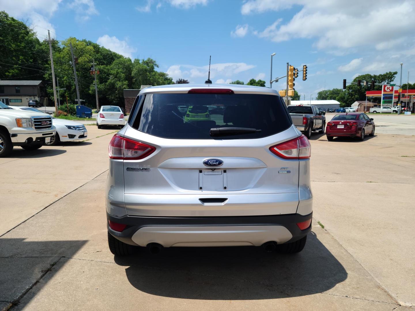2015 Ford Escape SE 4WD (1FMCU9GX6FU) with an 1.6L L4 DOHC 16V engine, 6-Speed Automatic transmission, located at 104 1st Avenue, Silvis, IL, 61282, (309) 755-9511, 41.515156, -90.425377 - Photo#2