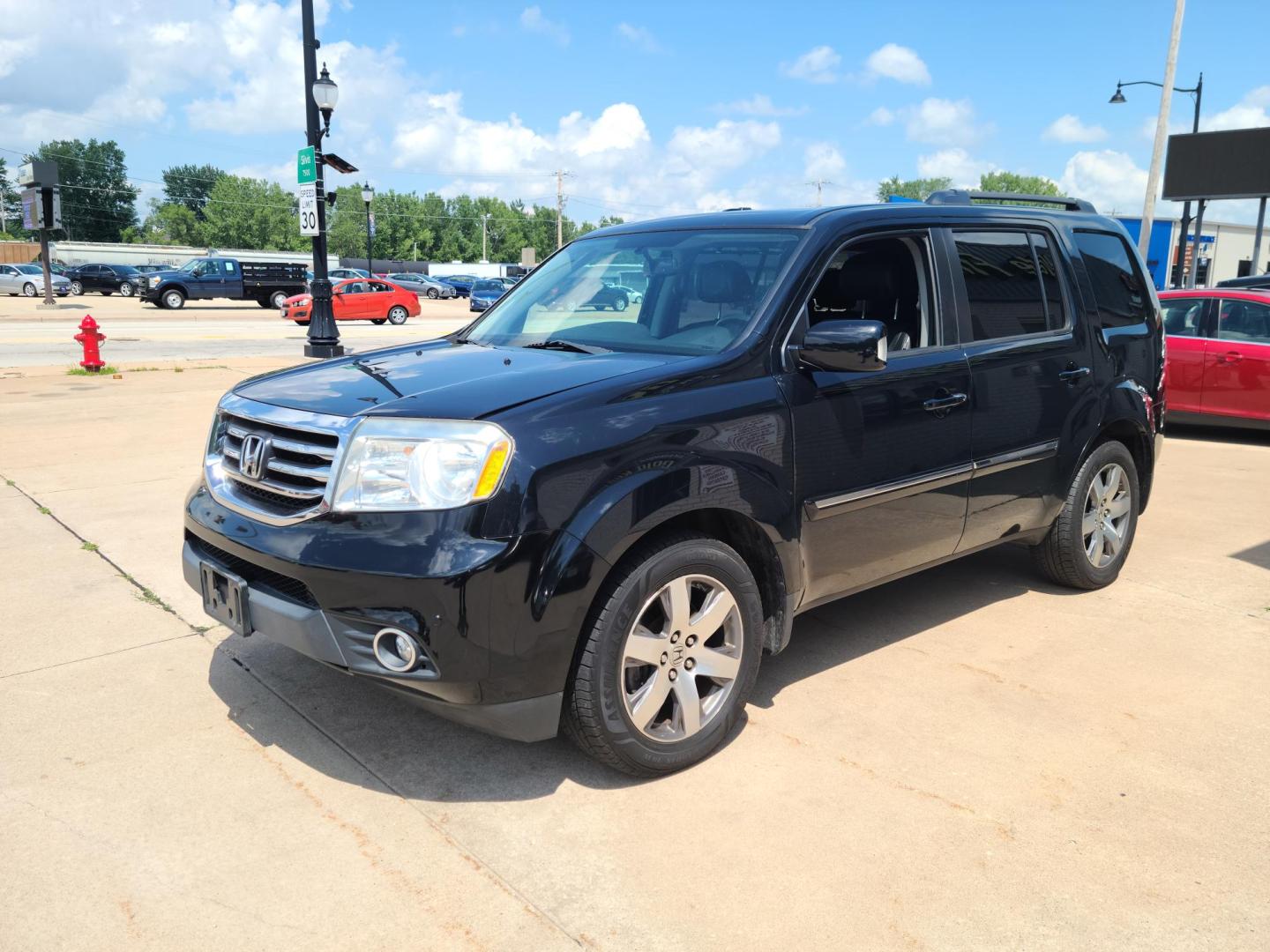 2013 Carbon Black Metallic /Black Honda Pilot Touring 4WD 5-Spd AT with DVD (5FNYF4H92DB) with an 3.5L V6 SOHC 24V engine, 5-Speed Automatic transmission, located at 104 1st Avenue, Silvis, IL, 61282, (309) 755-9511, 41.515156, -90.425377 - Photo#1