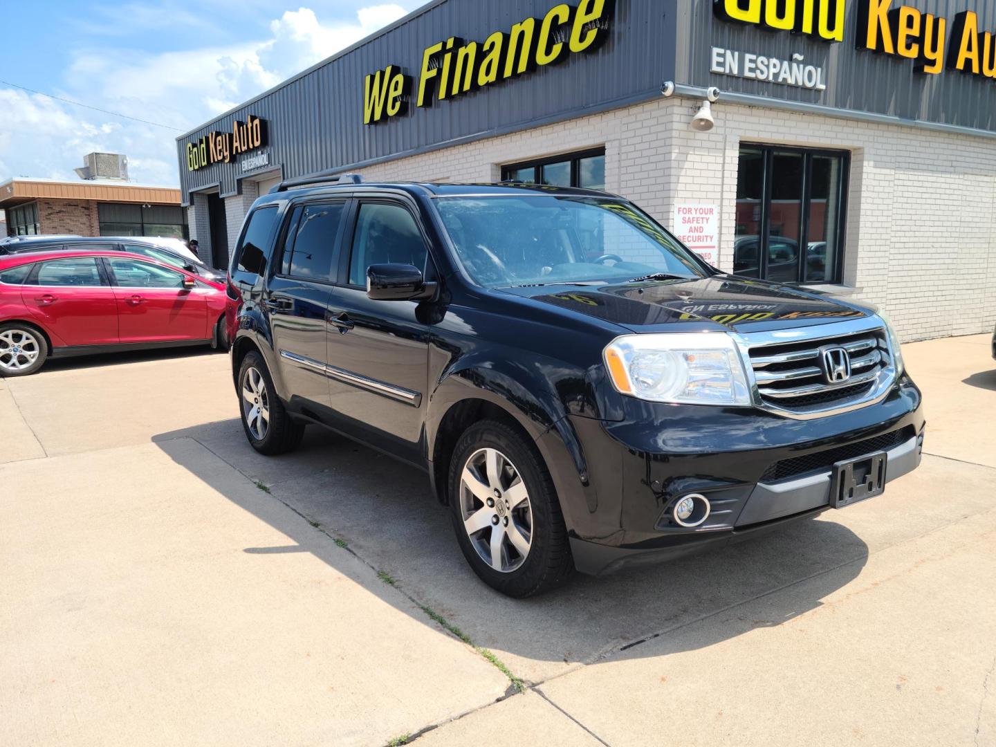 2013 Carbon Black Metallic /Black Honda Pilot Touring 4WD 5-Spd AT with DVD (5FNYF4H92DB) with an 3.5L V6 SOHC 24V engine, 5-Speed Automatic transmission, located at 104 1st Avenue, Silvis, IL, 61282, (309) 755-9511, 41.515156, -90.425377 - Photo#0