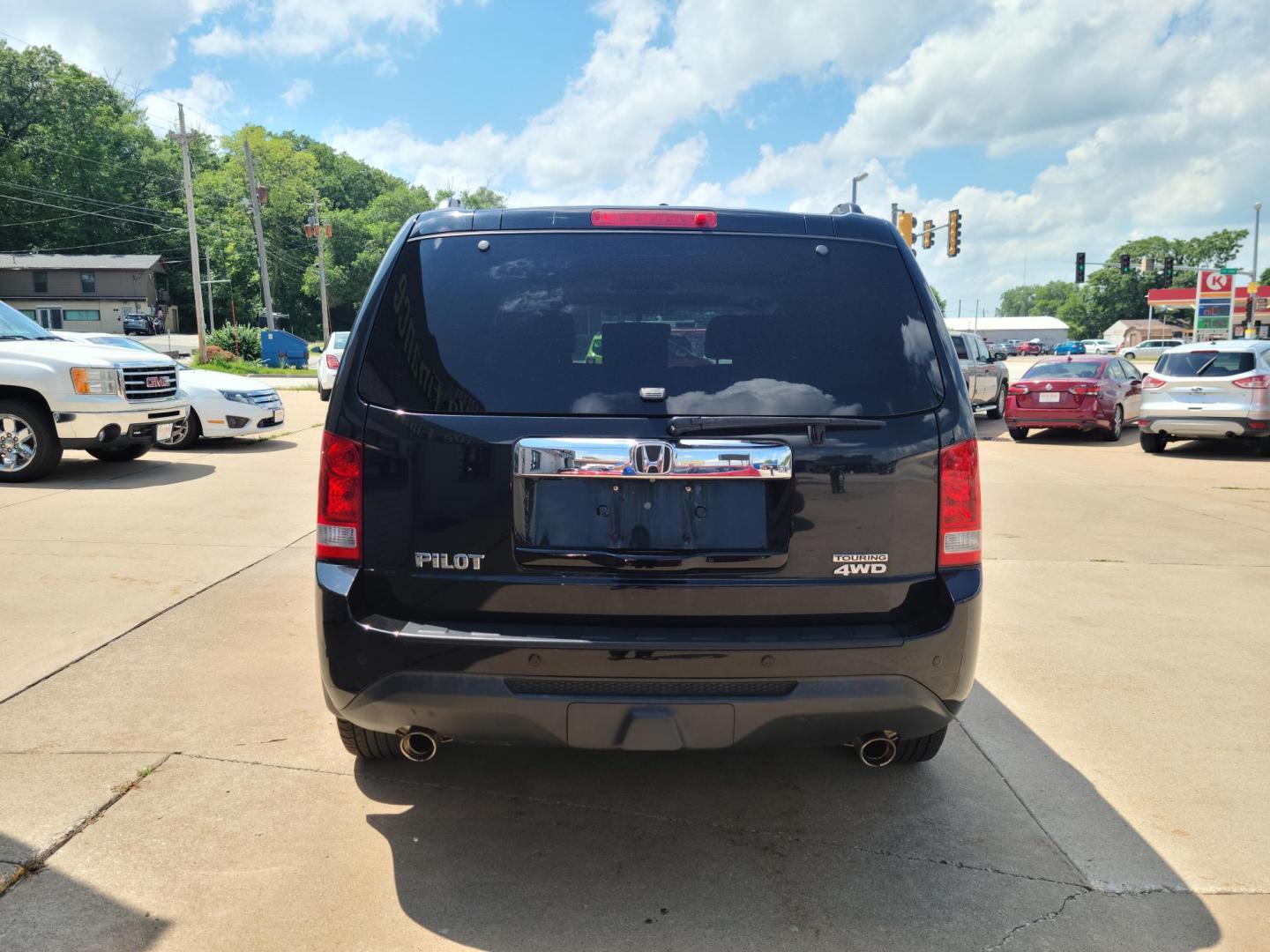 2013 Carbon Black Metallic /Black Honda Pilot Touring 4WD 5-Spd AT with DVD (5FNYF4H92DB) with an 3.5L V6 SOHC 24V engine, 5-Speed Automatic transmission, located at 104 1st Avenue, Silvis, IL, 61282, (309) 755-9511, 41.515156, -90.425377 - Photo#2
