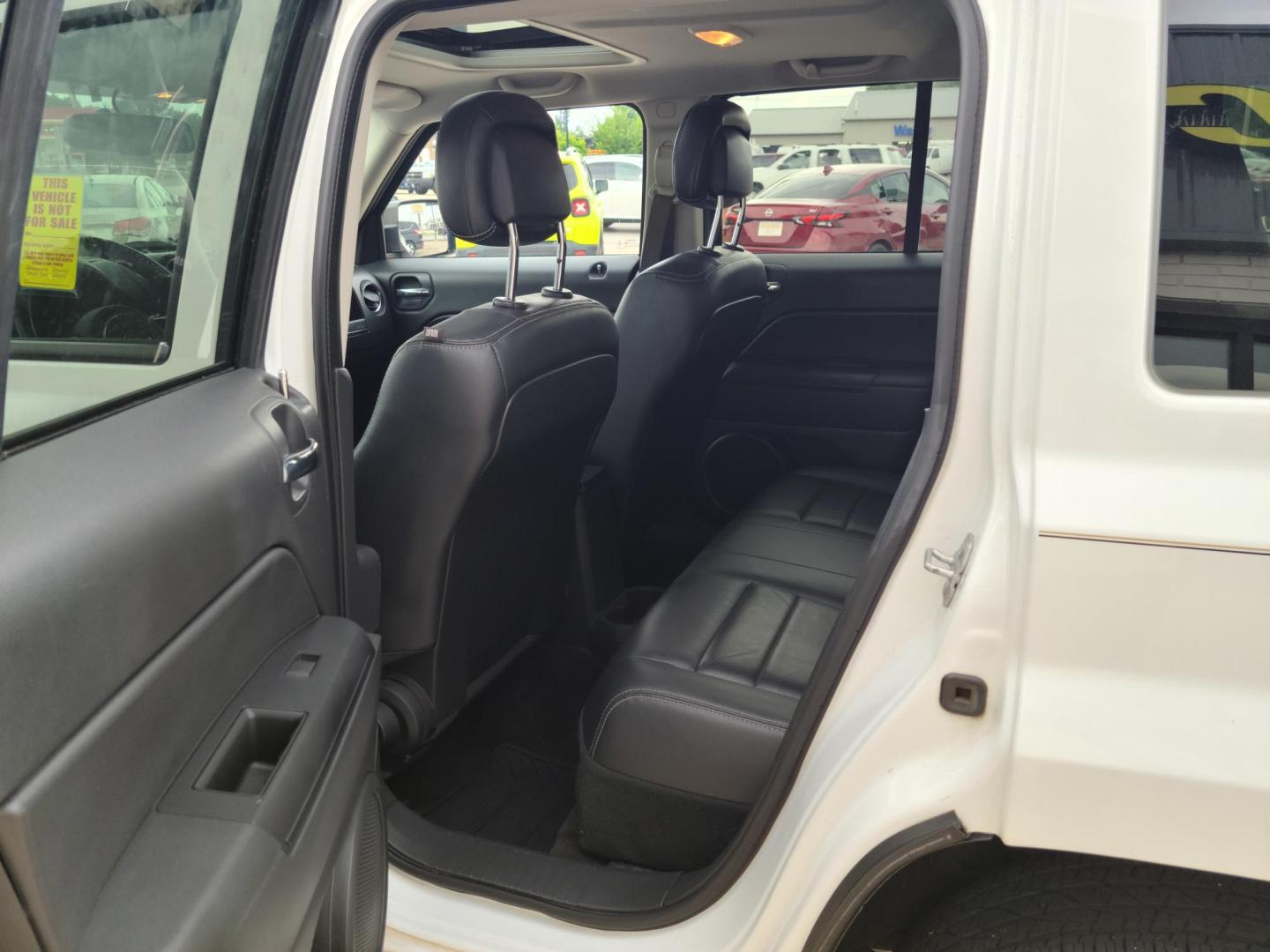 2016 Summit White /Black Jeep Patriot Latitude 4WD (1C4NJRFB1GD) with an 2.4L L4 DOHC 16V engine, Auto transmission, located at 104 1st Avenue, Silvis, IL, 61282, (309) 755-9511, 41.515156, -90.425377 - Photo#4