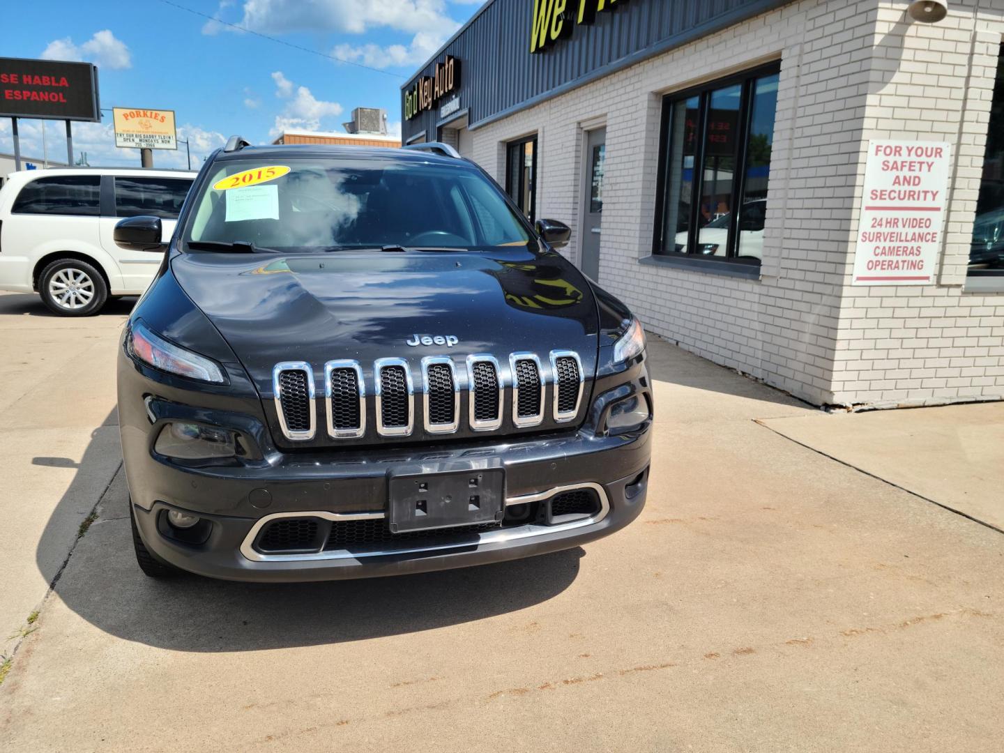 2015 Carbon Black Metallic /Black Jeep Cherokee Limited 4WD (1C4PJMDB2FW) with an 2.4L L4 DOHC 16V engine, 9-Speed Automatic transmission, located at 104 1st Avenue, Silvis, IL, 61282, (309) 755-9511, 41.515156, -90.425377 - Photo#1