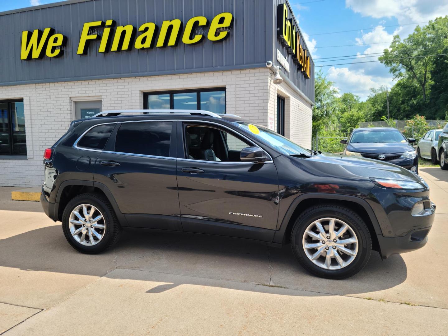 2015 Carbon Black Metallic /Black Jeep Cherokee Limited 4WD (1C4PJMDB2FW) with an 2.4L L4 DOHC 16V engine, 9-Speed Automatic transmission, located at 104 1st Avenue, Silvis, IL, 61282, (309) 755-9511, 41.515156, -90.425377 - Photo#0
