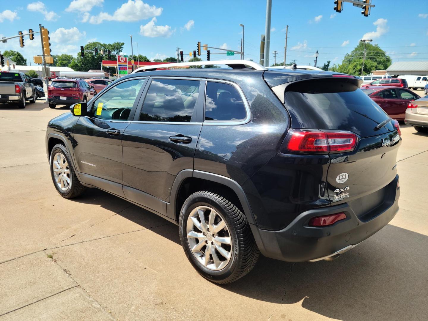 2015 Carbon Black Metallic /Black Jeep Cherokee Limited 4WD (1C4PJMDB2FW) with an 2.4L L4 DOHC 16V engine, 9-Speed Automatic transmission, located at 104 1st Avenue, Silvis, IL, 61282, (309) 755-9511, 41.515156, -90.425377 - Photo#2