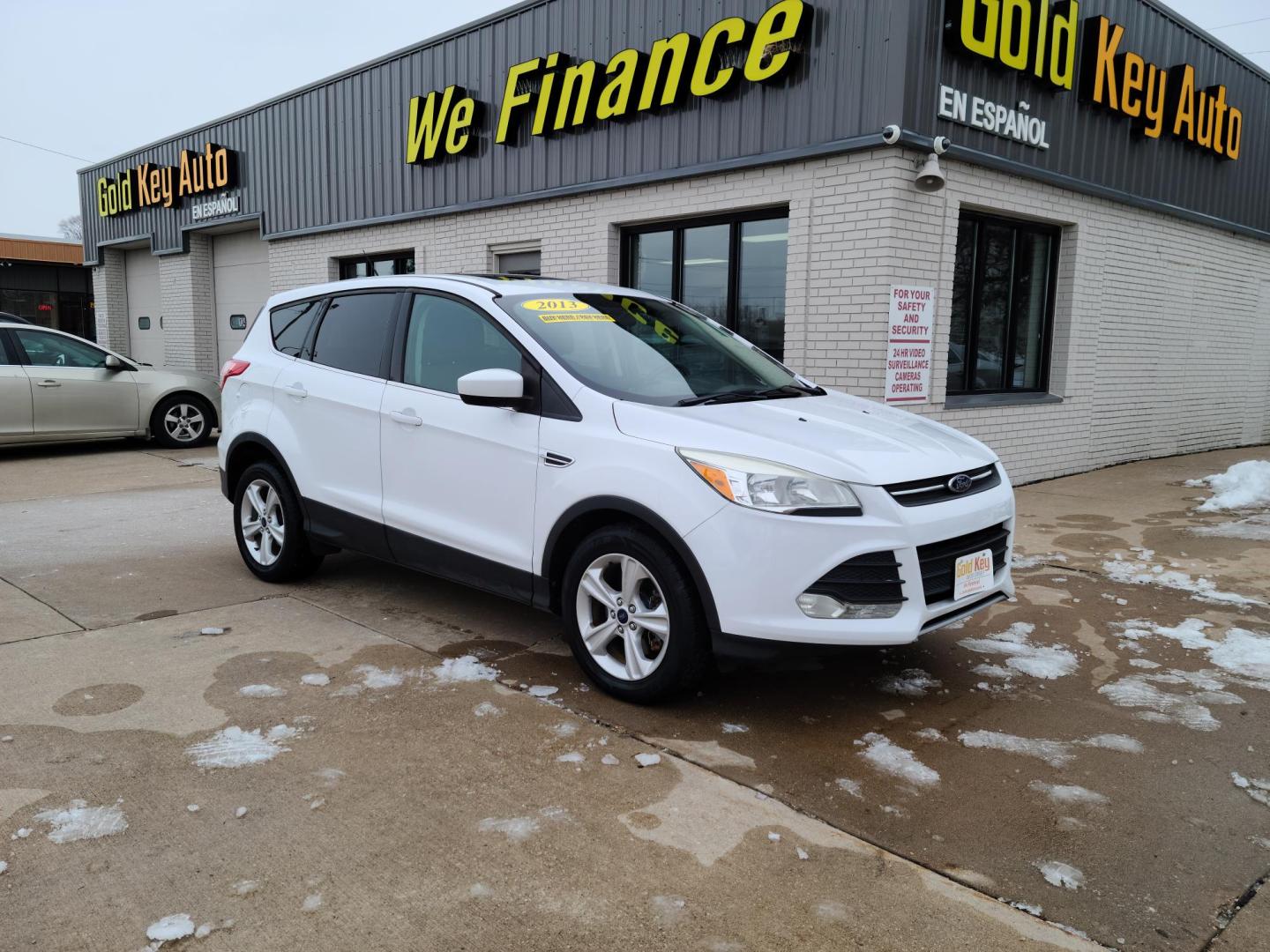 2014 Ford Escape SE 4WD (1FMCU9GX9EU) with an 1.6L L4 DOHC 16V engine, 6-Speed Automatic transmission, located at 104 1st Avenue, Silvis, IL, 61282, (309) 755-9511, 41.515156, -90.425377 - Photo#0