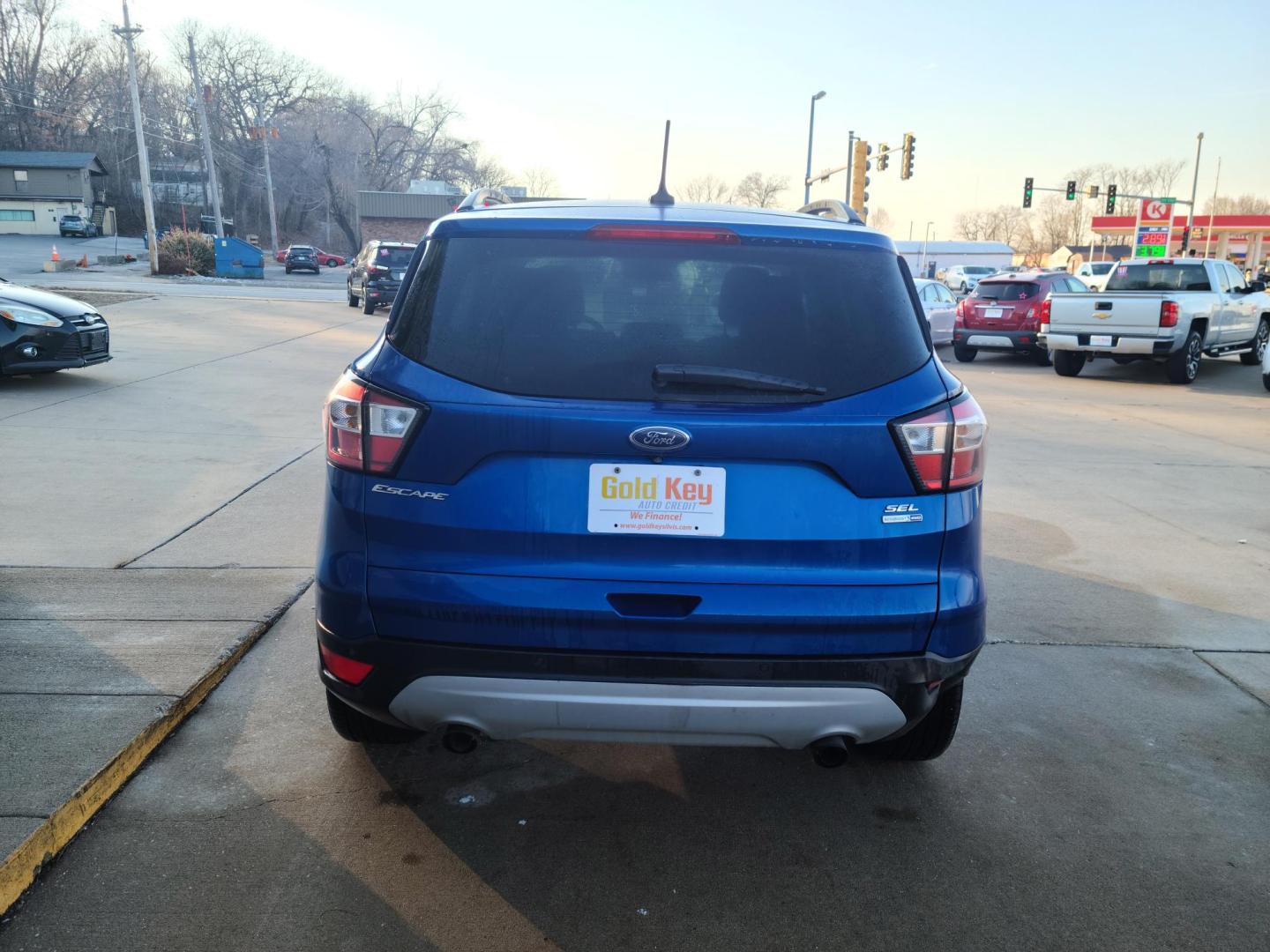 2018 Midnight Blue Metallic Ford Escape SEL 4WD (1FMCU9HDXJU) with an 1.5L L4 DOHC 16V engine, 6A transmission, located at 104 1st Avenue, Silvis, IL, 61282, (309) 755-9511, 41.515156, -90.425377 - Photo#3
