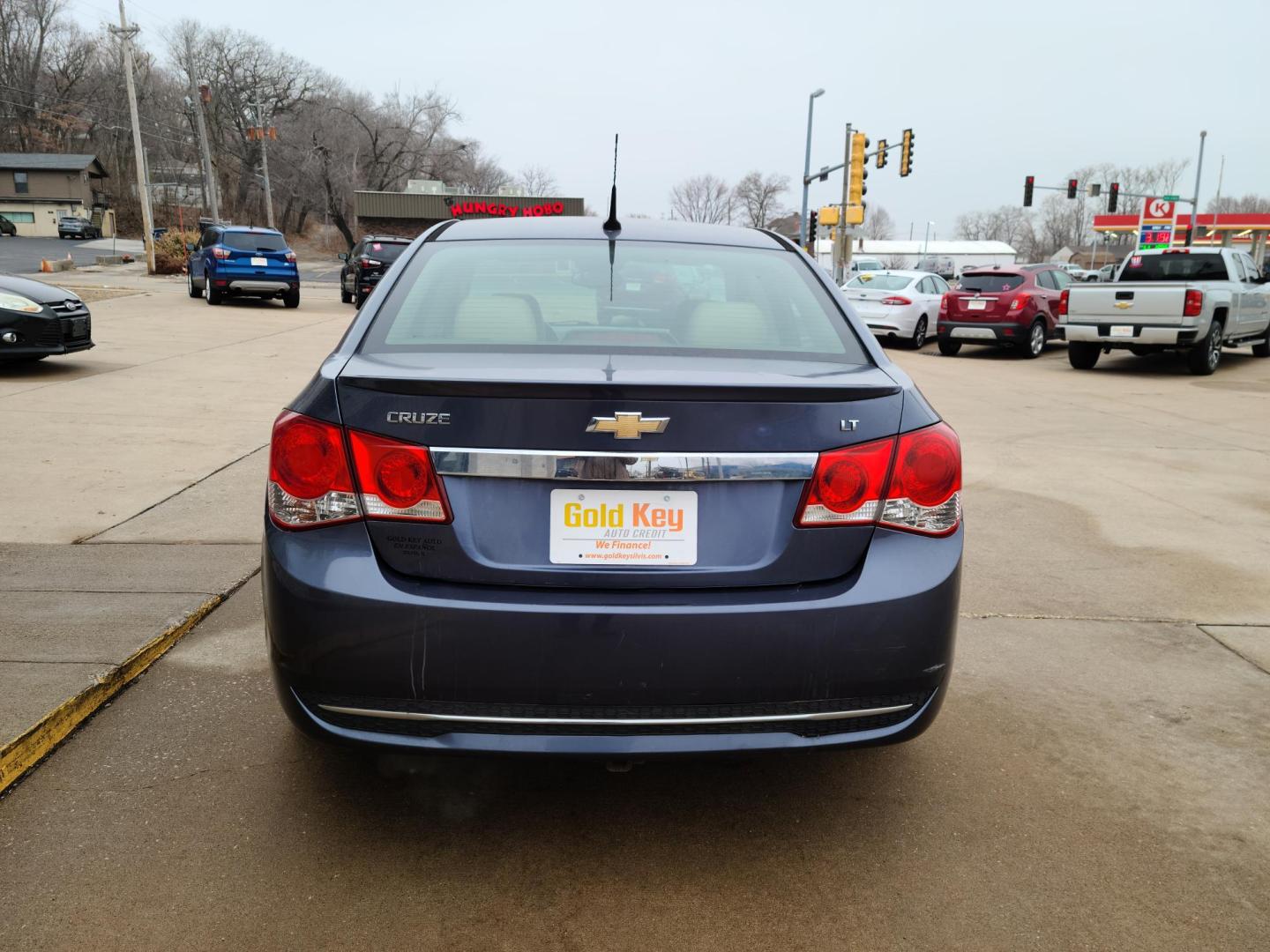 2013 Midnight Blue Metallic /Tan Chevrolet Cruze 2LT Auto (1G1PE5SB0D7) with an 1.4L L4 DOHC 16V TURBO engine, 6-Speed Automatic transmission, located at 104 1st Avenue, Silvis, IL, 61282, (309) 755-9511, 41.515156, -90.425377 - Photo#3