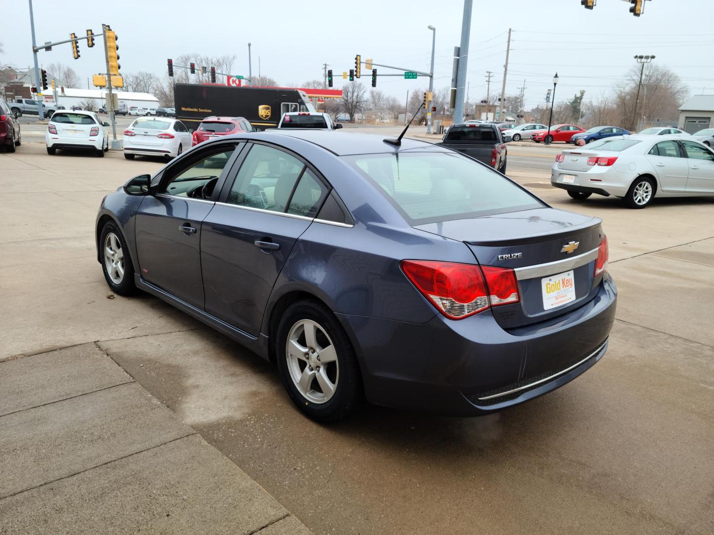 2013 Midnight Blue Metallic /Tan Chevrolet Cruze 2LT Auto (1G1PE5SB0D7) with an 1.4L L4 DOHC 16V TURBO engine, 6-Speed Automatic transmission, located at 104 1st Avenue, Silvis, IL, 61282, (309) 755-9511, 41.515156, -90.425377 - Photo#2